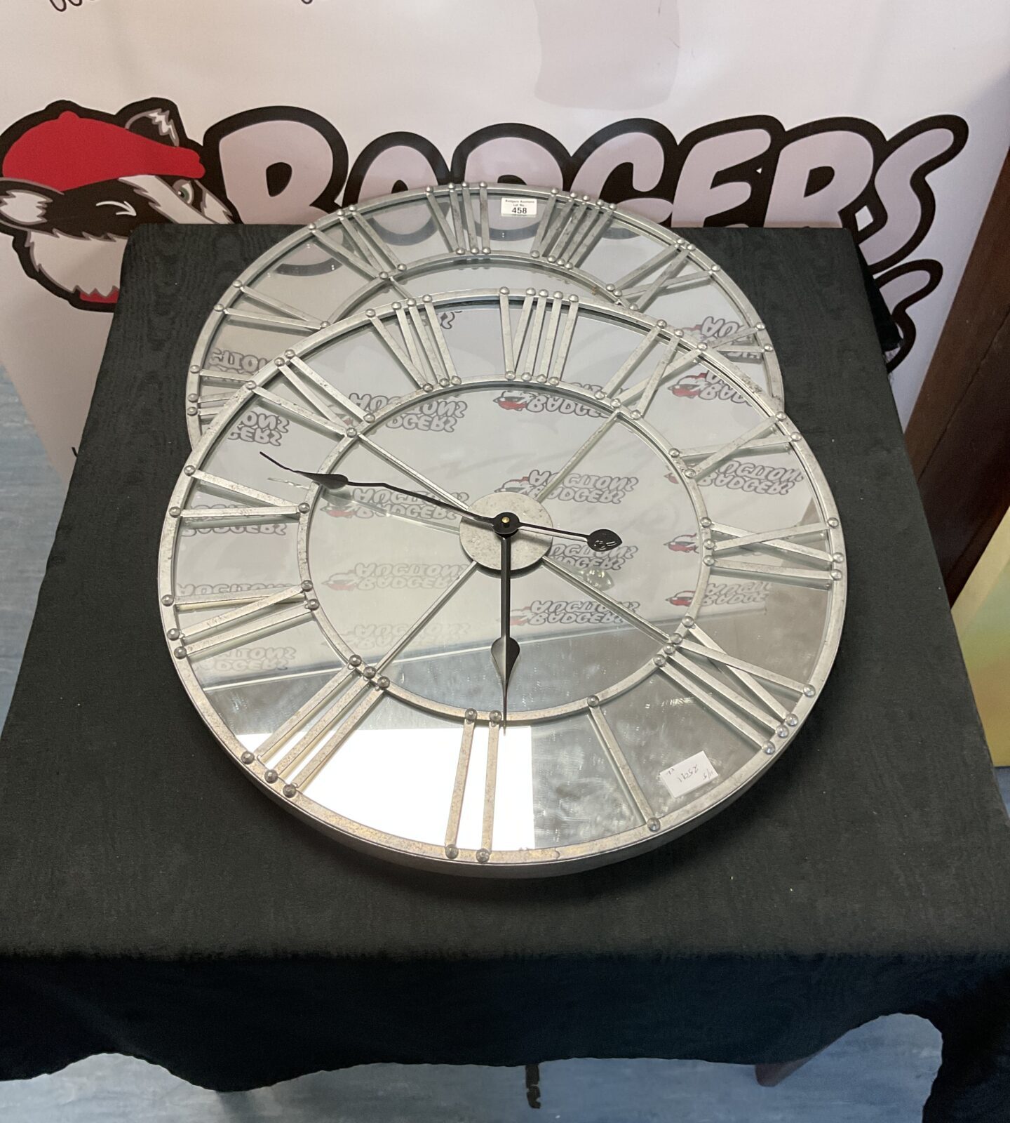Two dunelm mirrored clocks