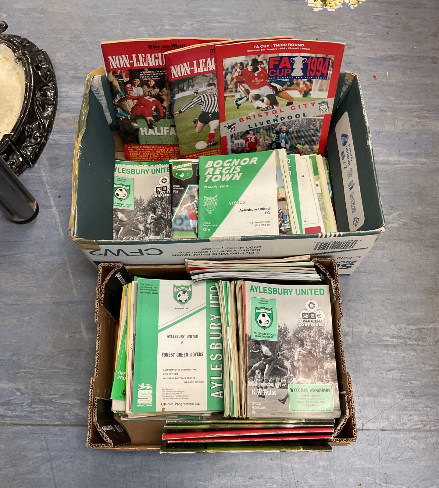 Two boxes of Aylesbury united football programs