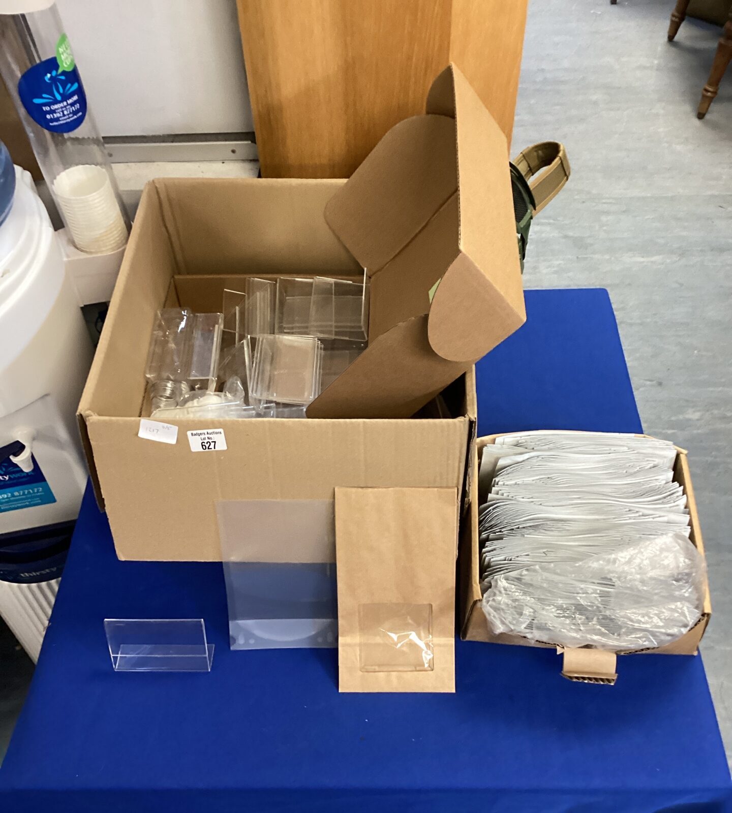 Box of mixed stationary inc baggies, sweet bags, card holders & bottles