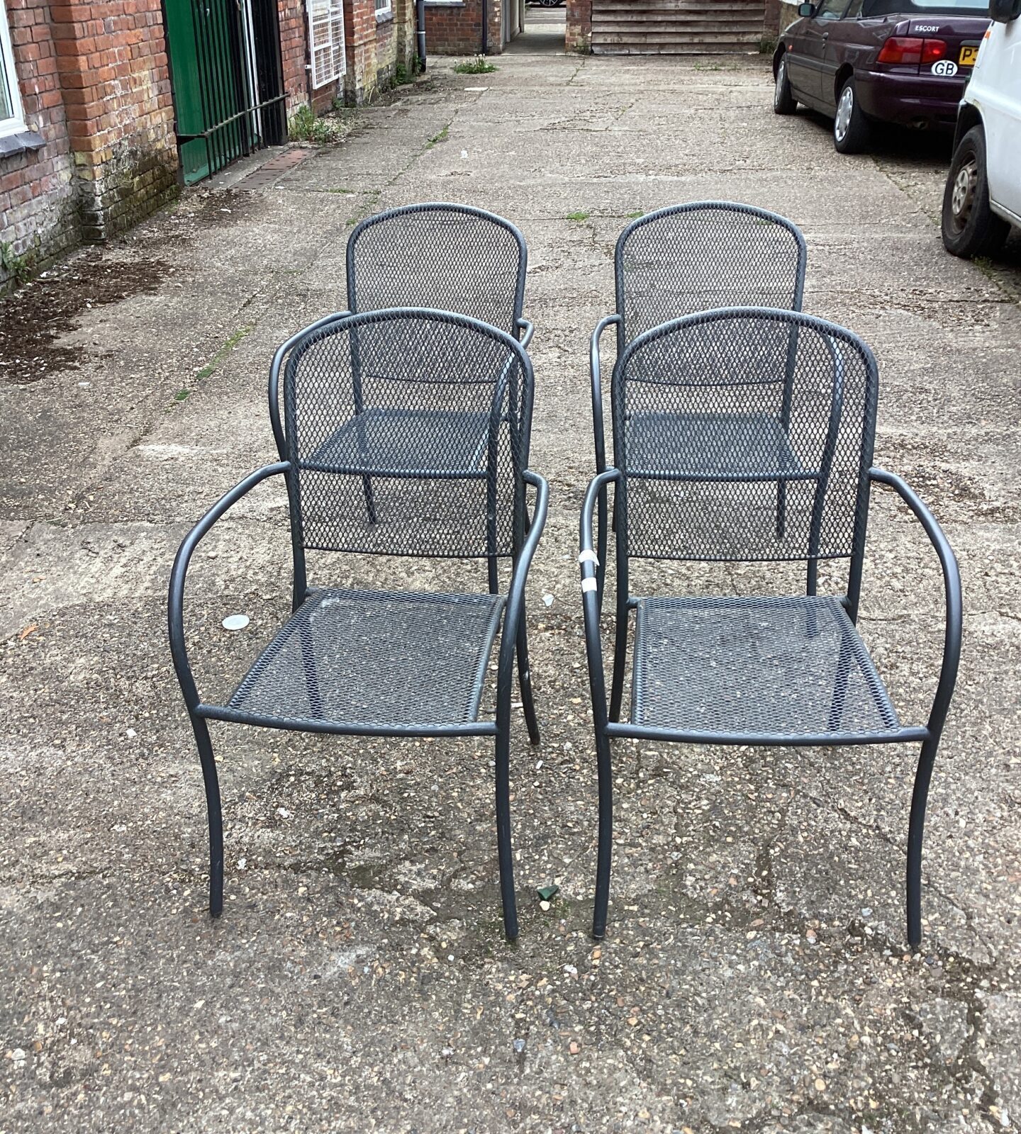 Four metal garden chairs