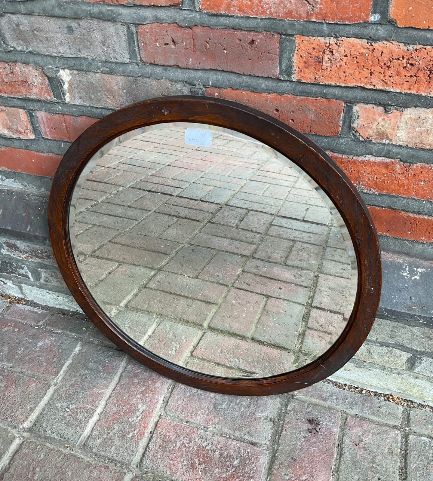 Round oak framed bevel edged mirror