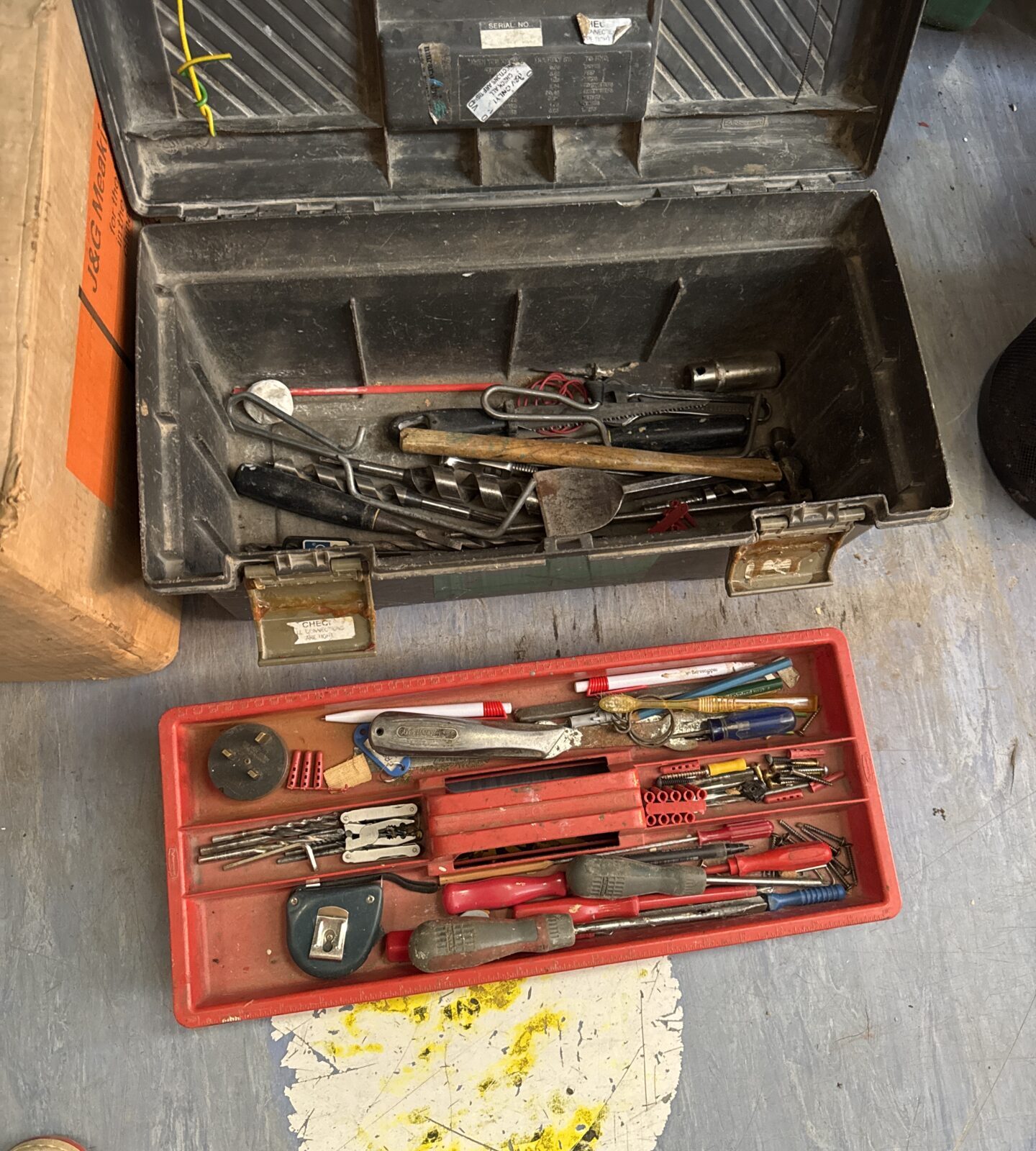 Curved plastic toolbox with contents