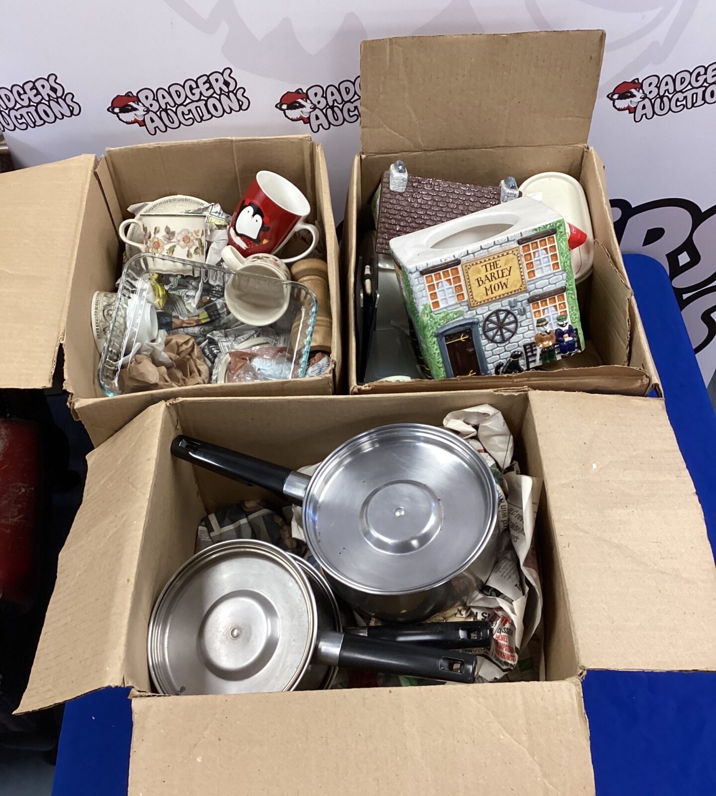 Three boxes of mixed kitchenware inc pots & pans with mixed cups, plates & saucers