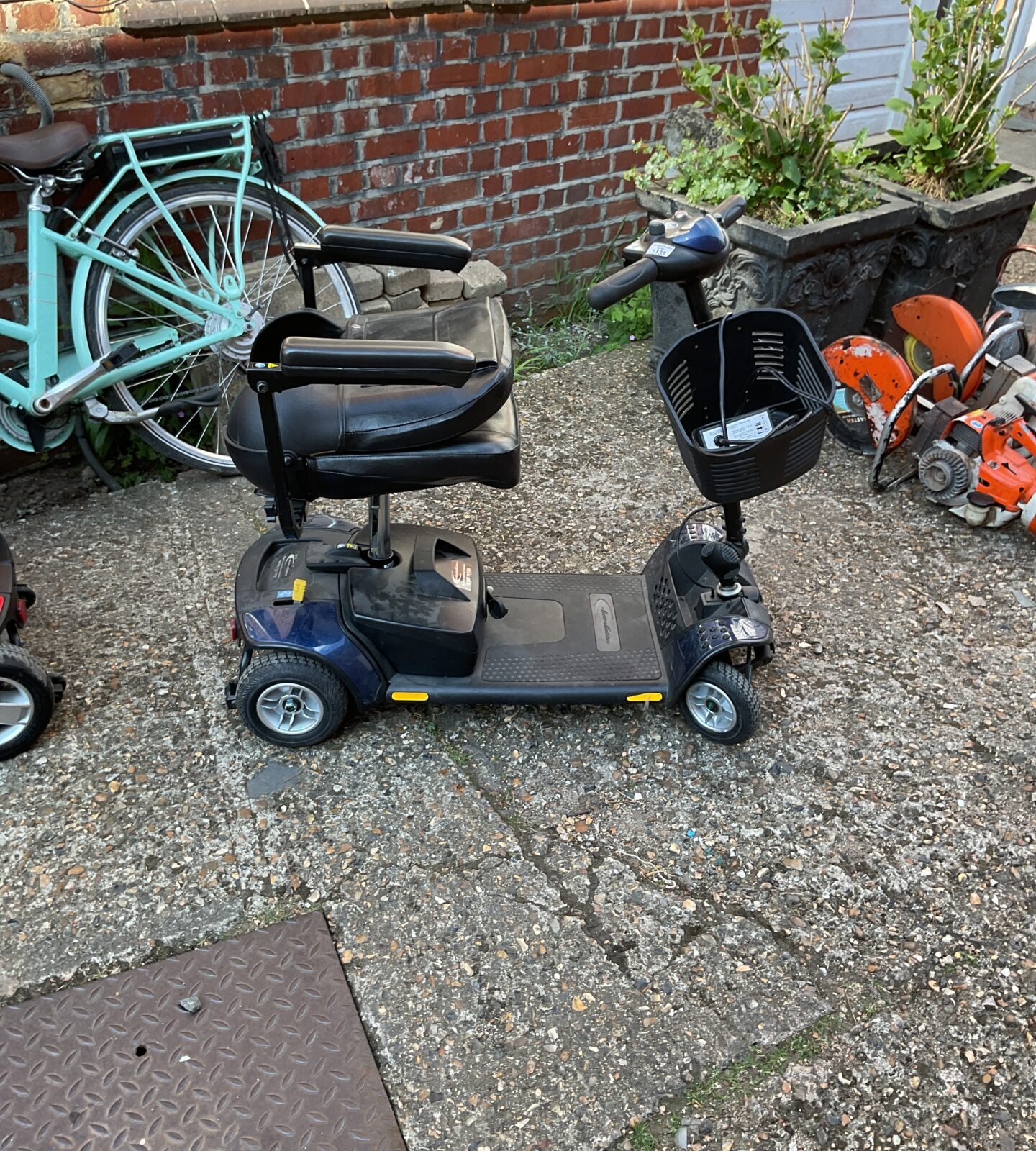 Electro motion mobility scooter with battery and keys