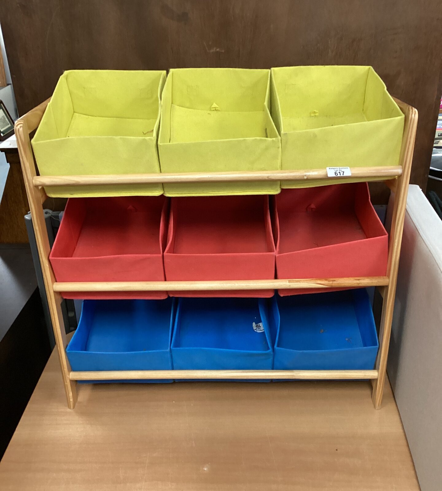 Multi coloured fabric storage boxes with wooden rack
