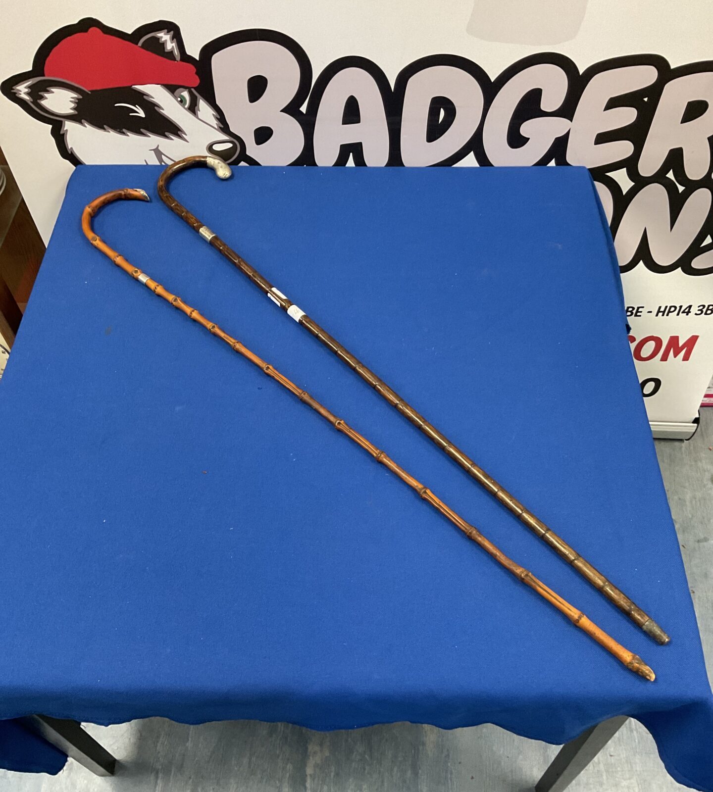 Two vintage walking canes with sterling silver knops & cuff