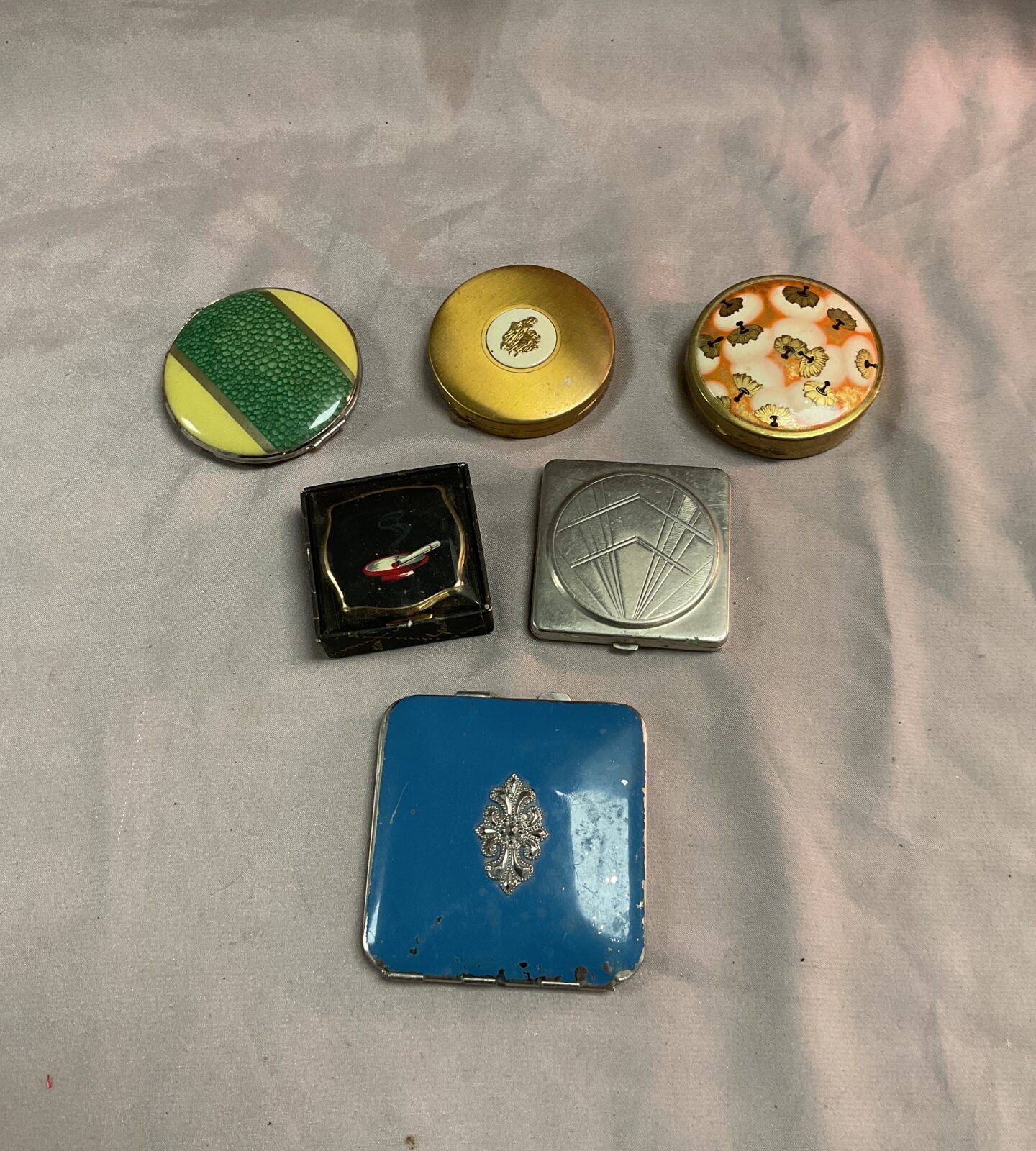 Six Vintage powder compacts