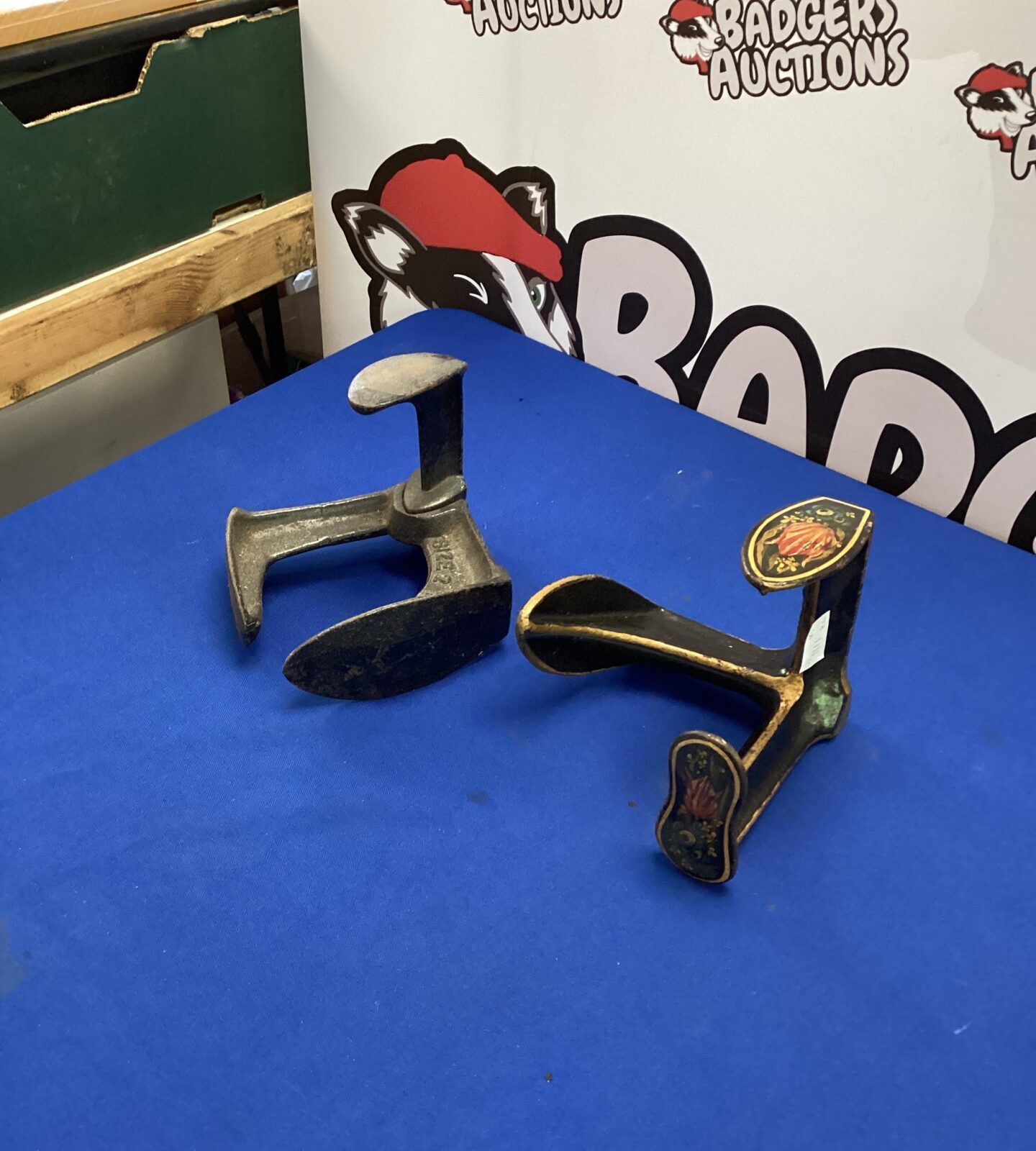 Two decorative wrought iron shoe lasts