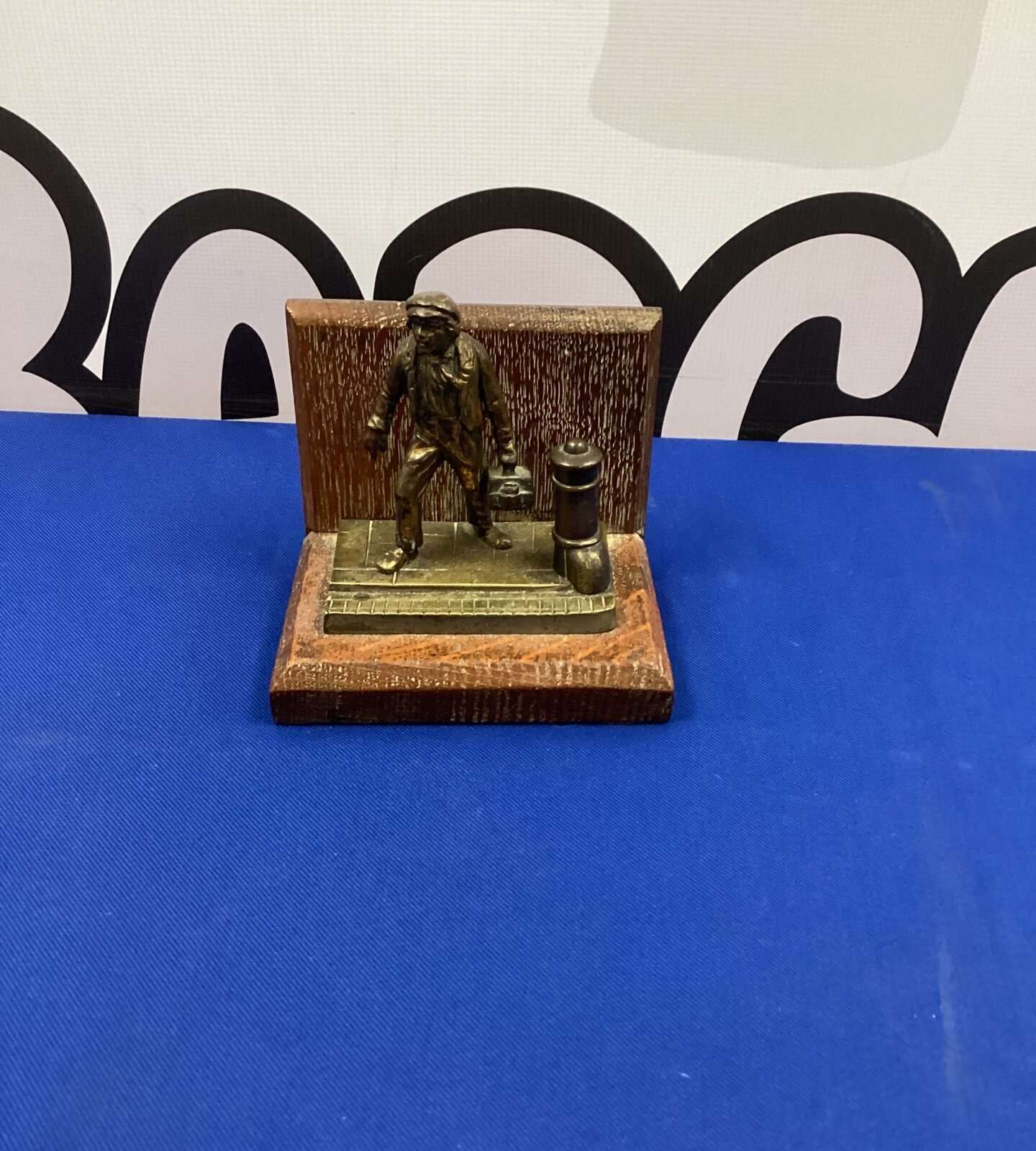 Bronze figurine of a working man