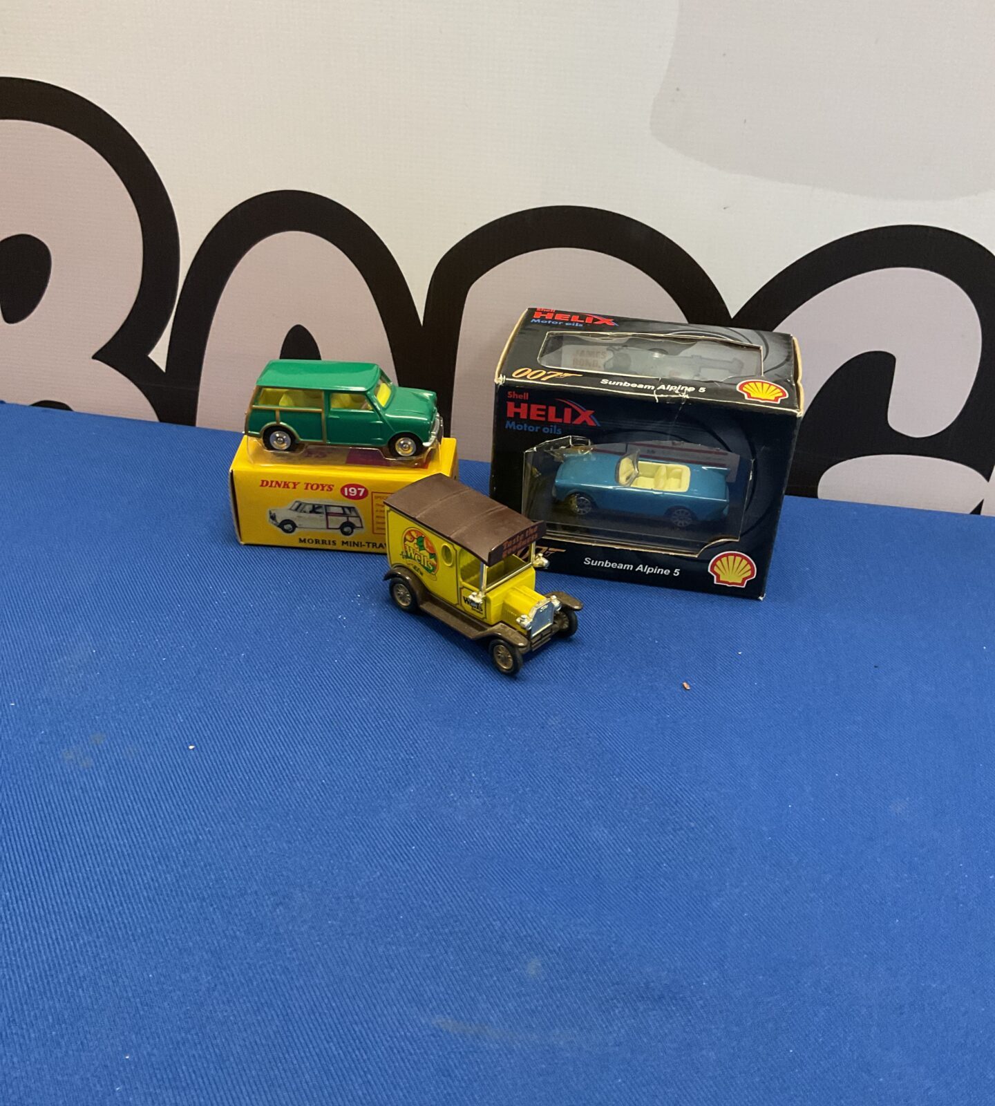 Three diecast models inc days gone, dinky and shell helix