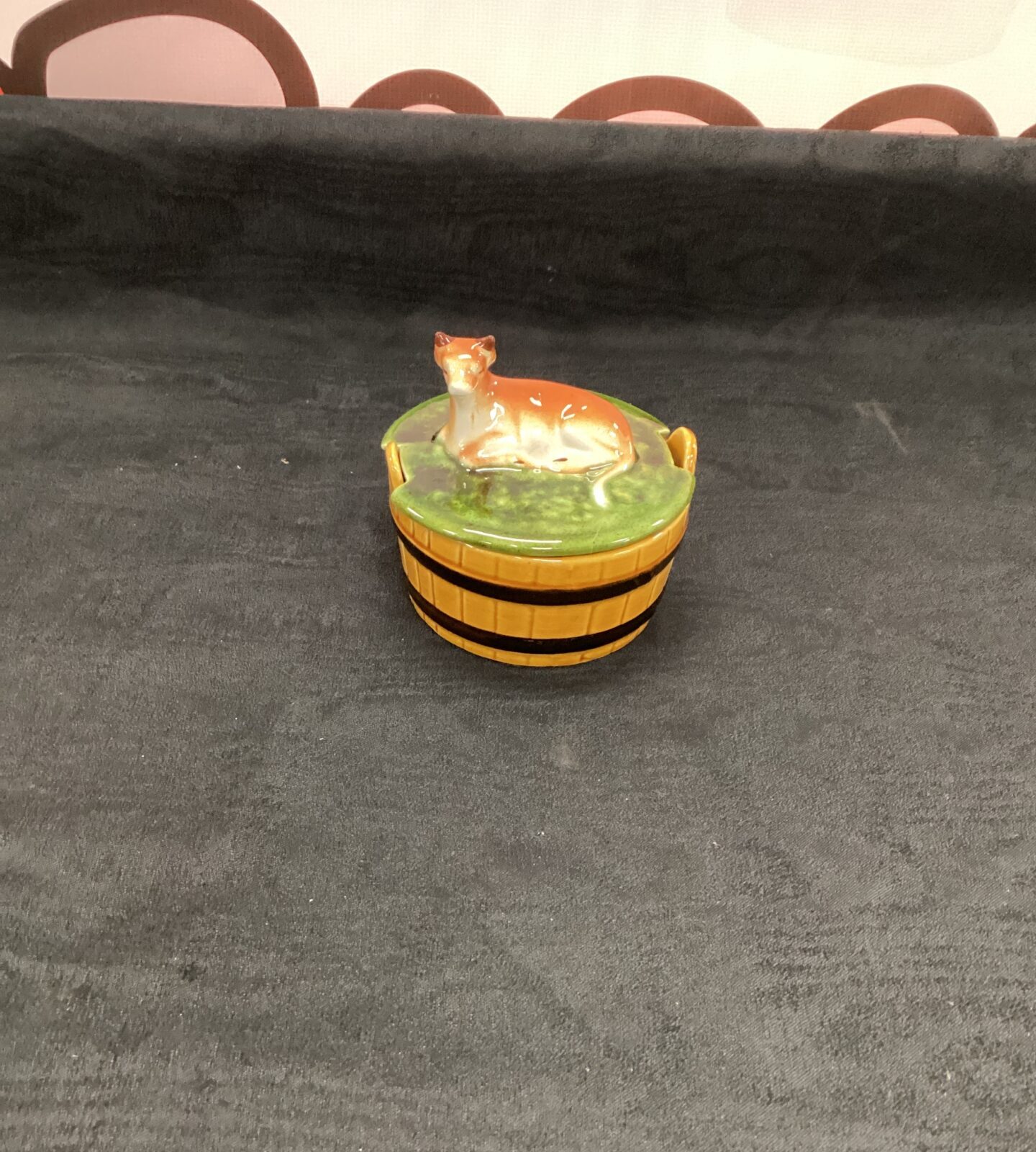Glazed pottery butter dish with cow lid