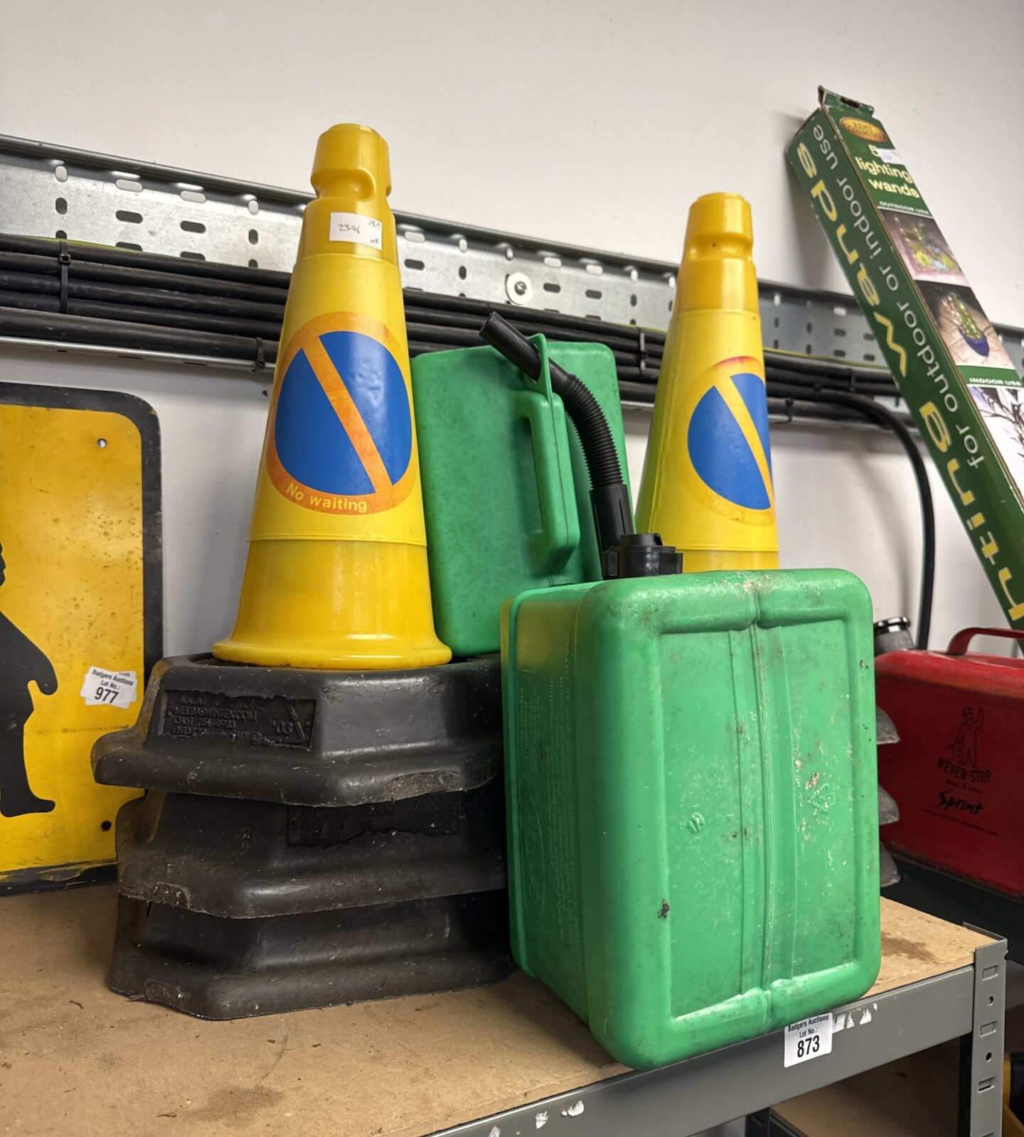 Six no waiting traffic cones with two plastic jerry cans