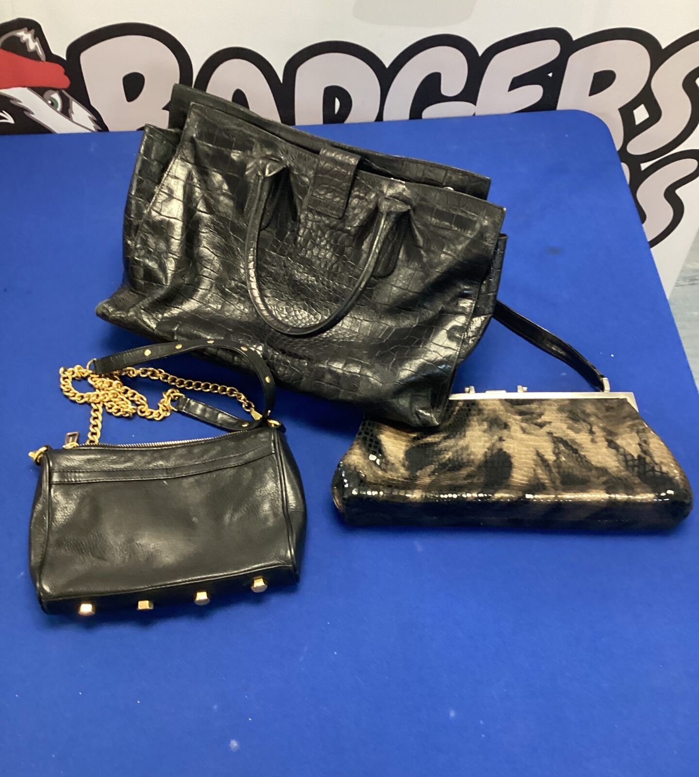 Three ladies handbags