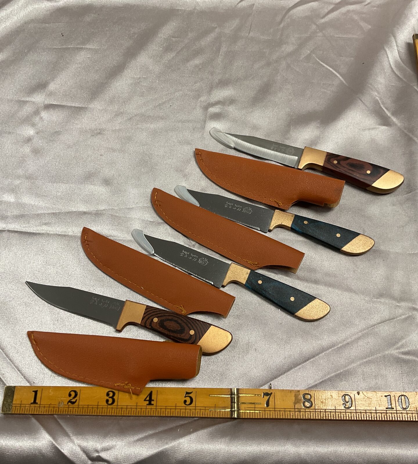 Four small sheath knives