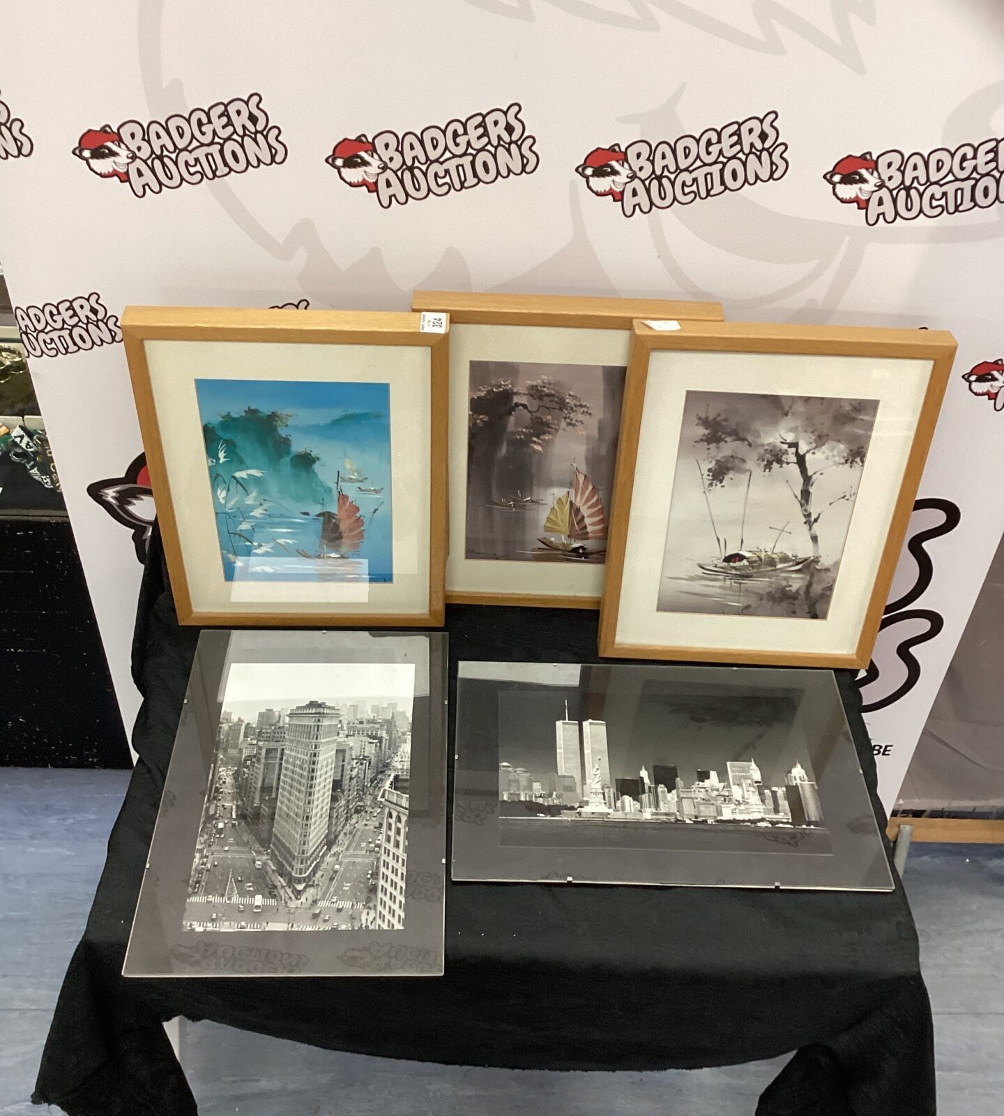 Three Japanese scene prints and two blackand white photos of New York