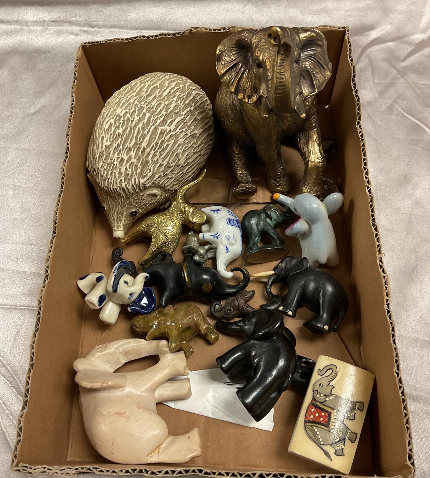 Assorted collection of wood , ceramic and brass Elephants and a hedgehog