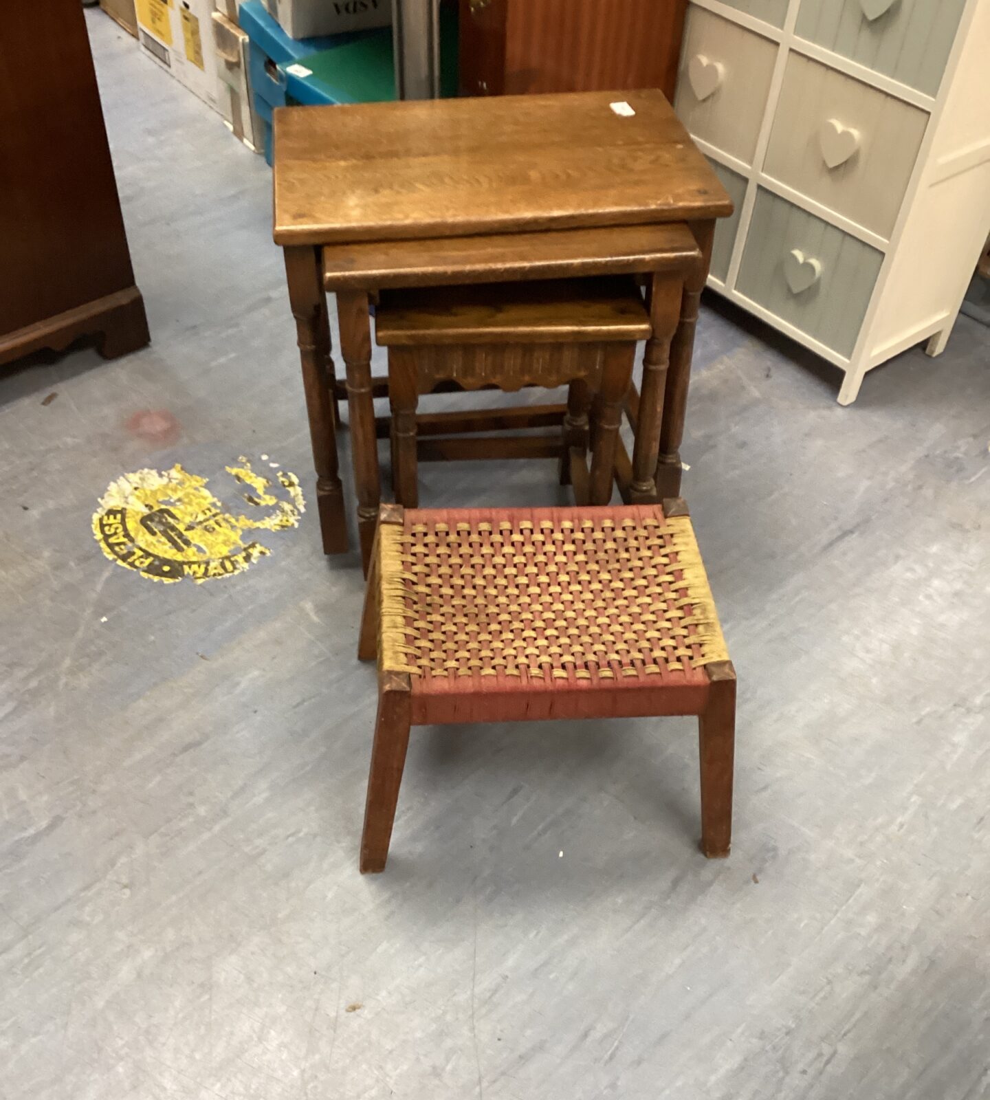 Nest of oak tables with raffia topped foot stool