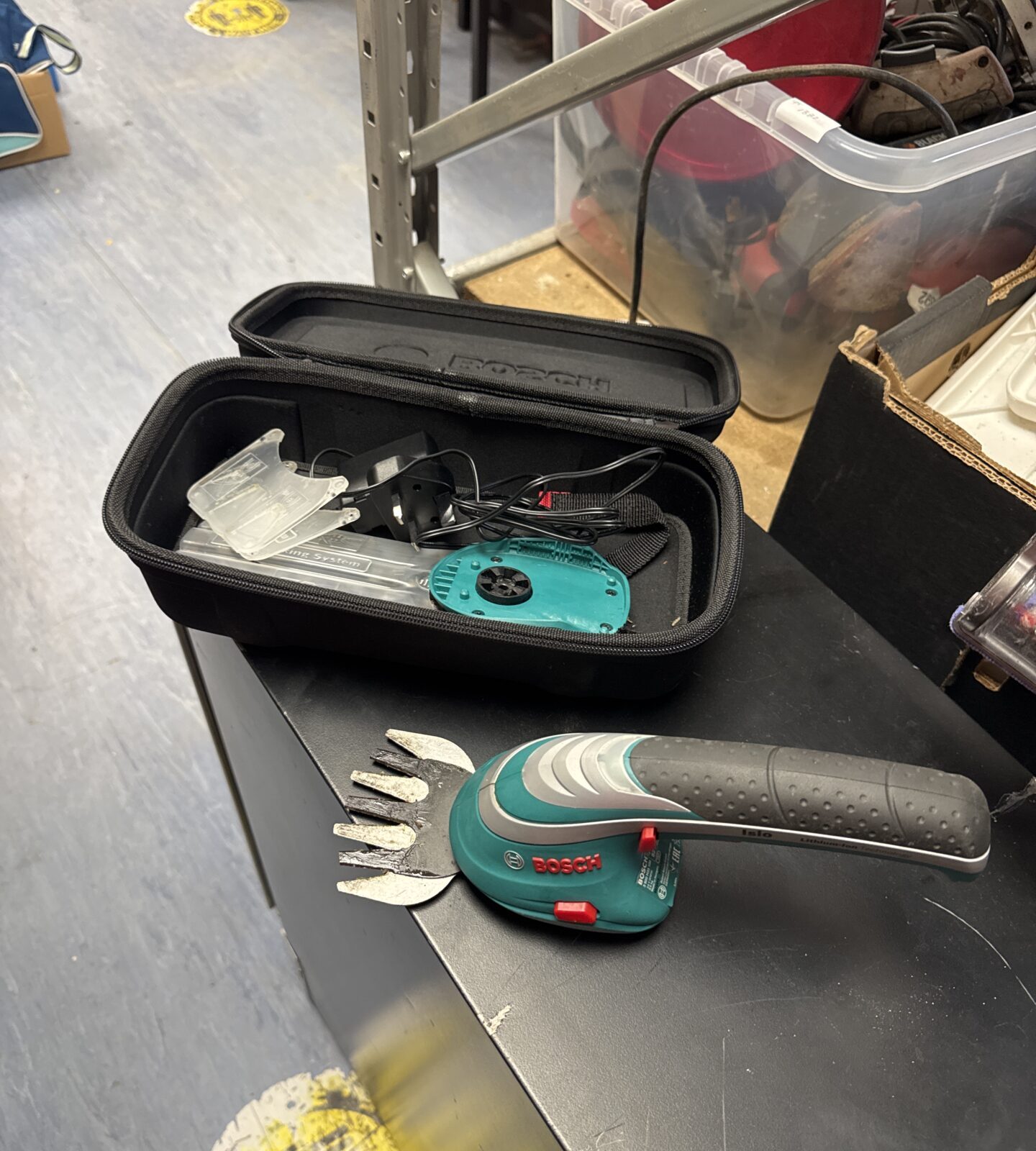 Bosch cordless handy trimmer with charger & attachments - working