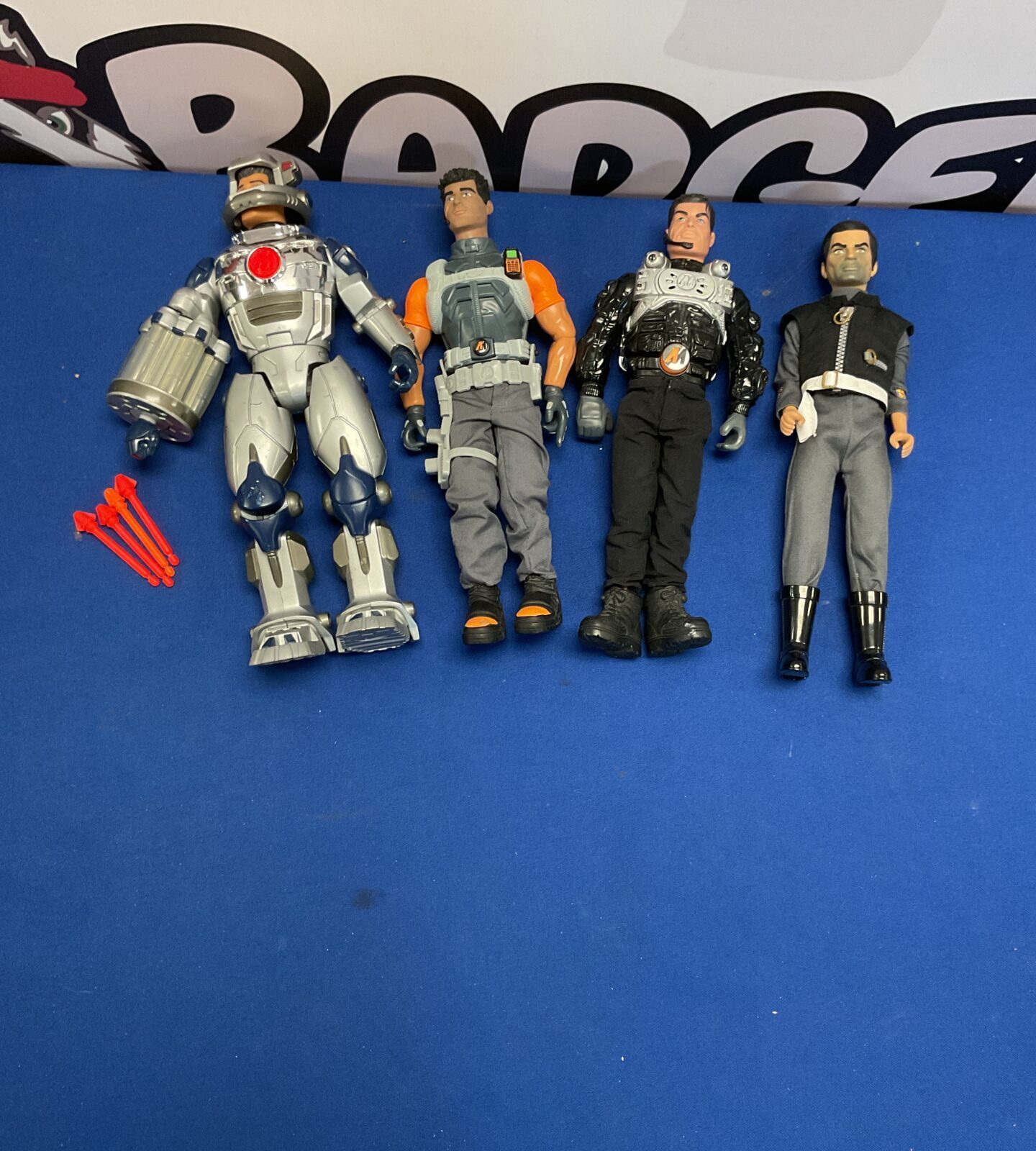 Three retro action man figures and spectrum captain black figure