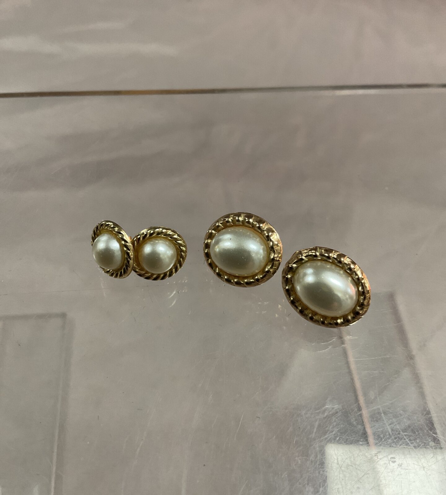 Pair 9ct gold stud earrings and one other