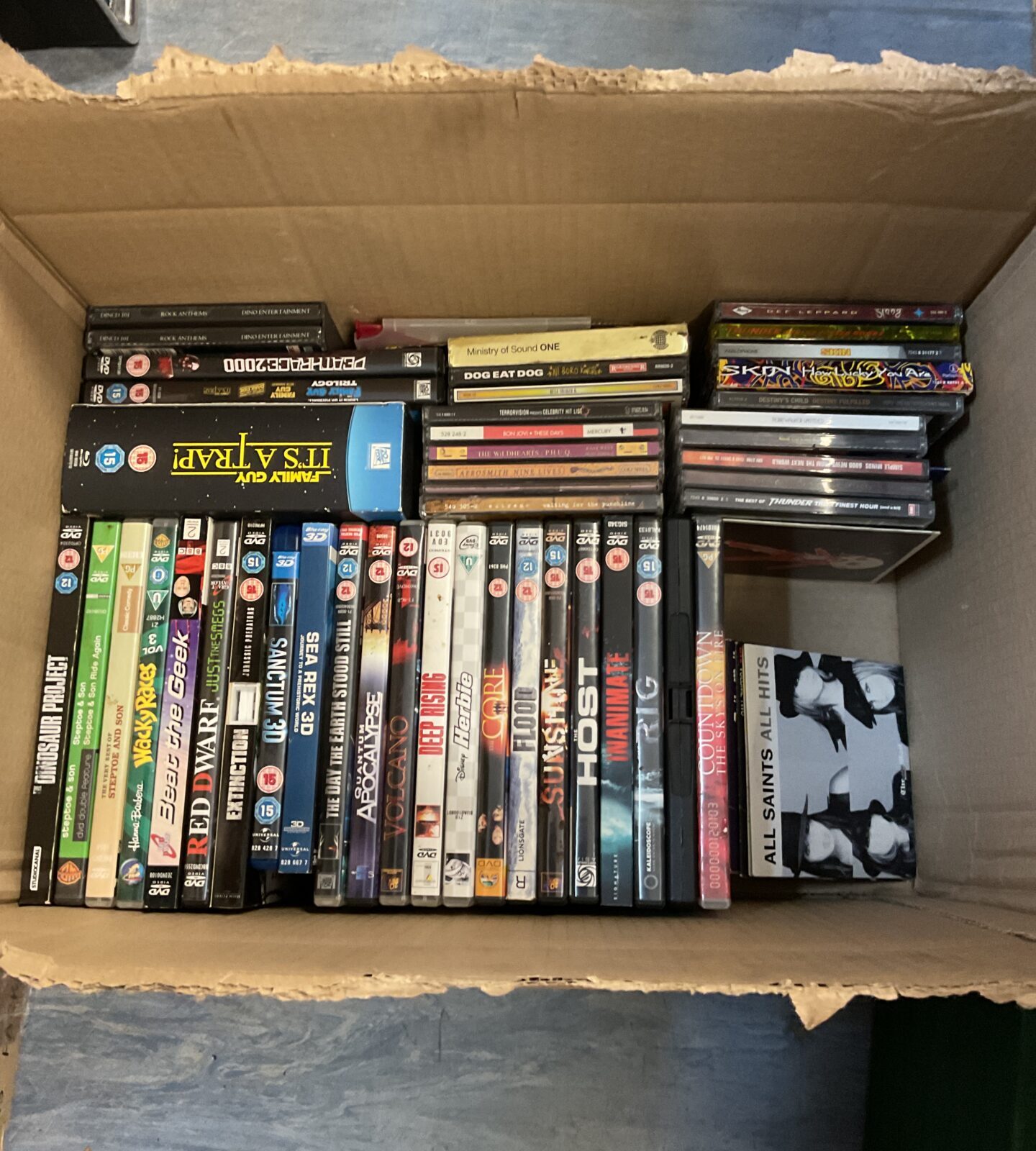 Box of dvds, blurays & music cds