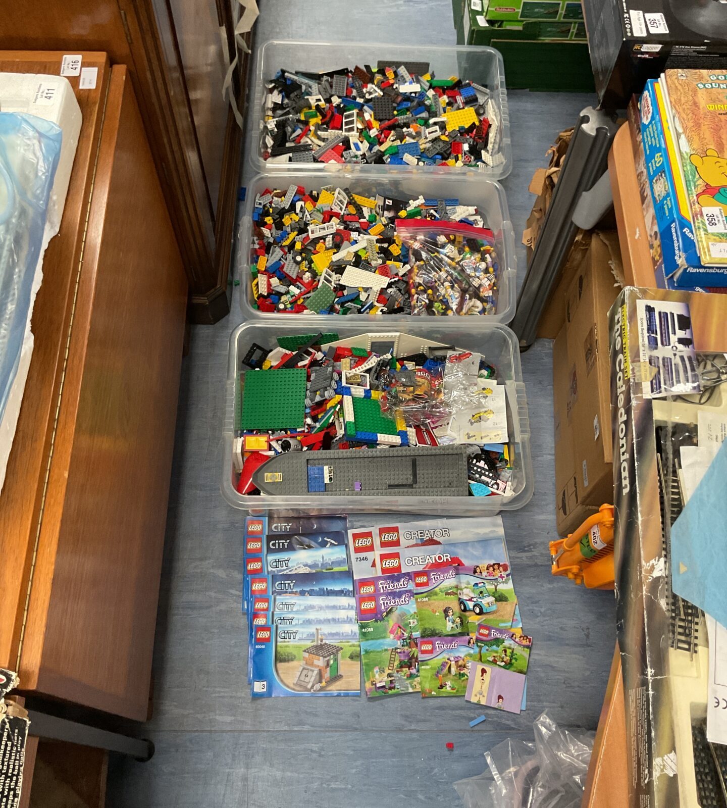 Three large crates of mixed Lego inc manuals and some figures