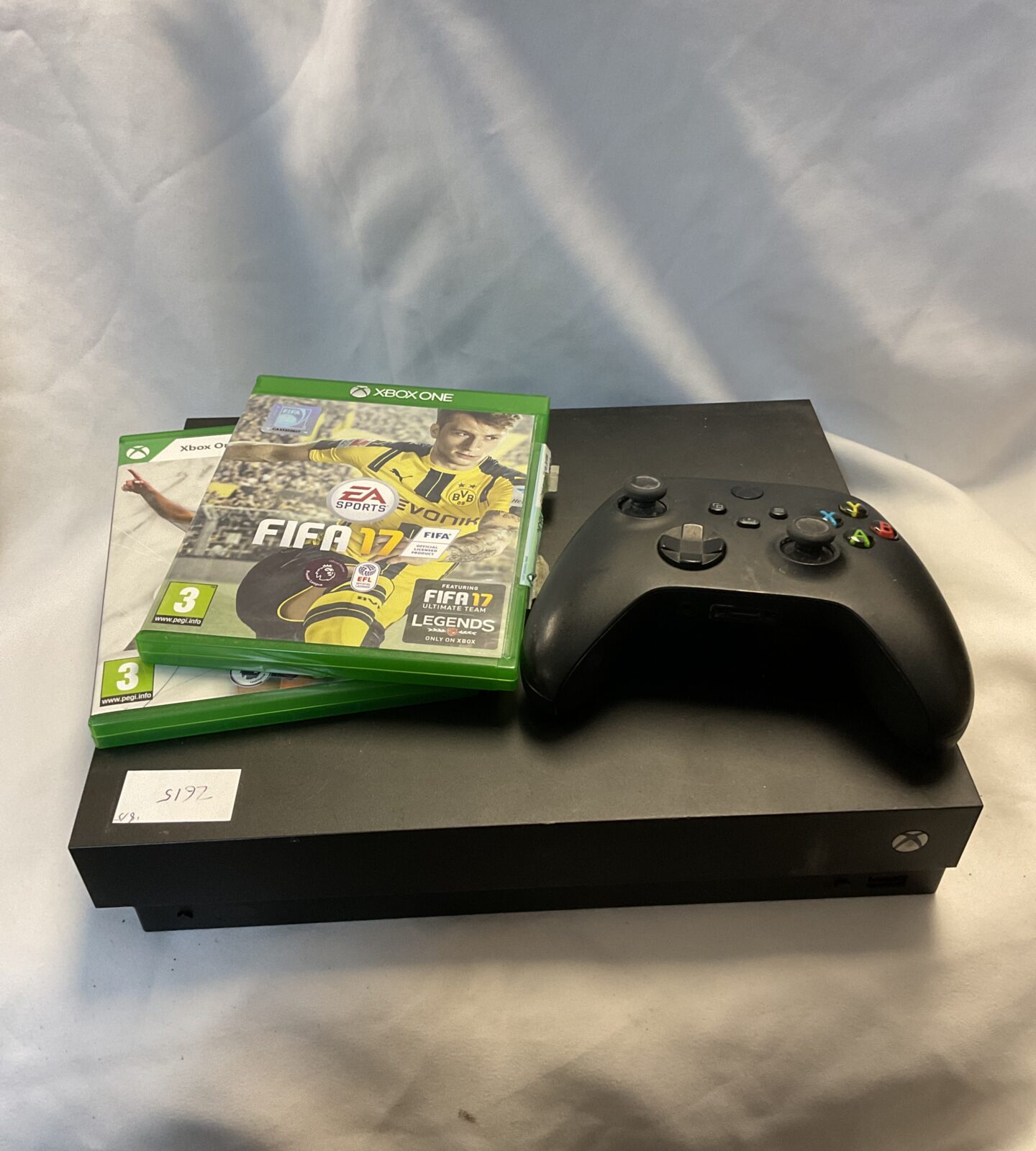 Microsoft Xbox One x console with controller
