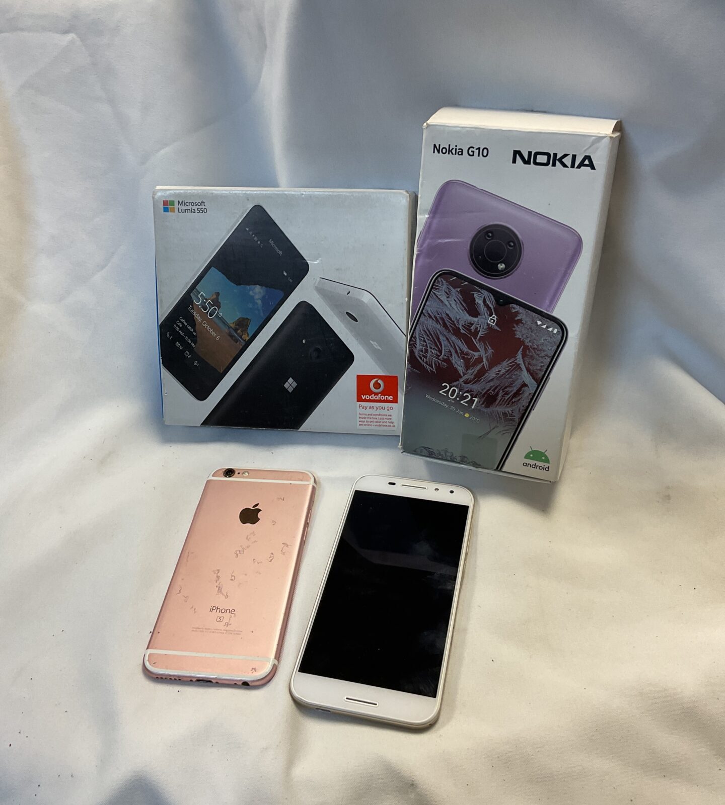Four mobile phones including apple iphone & nokia