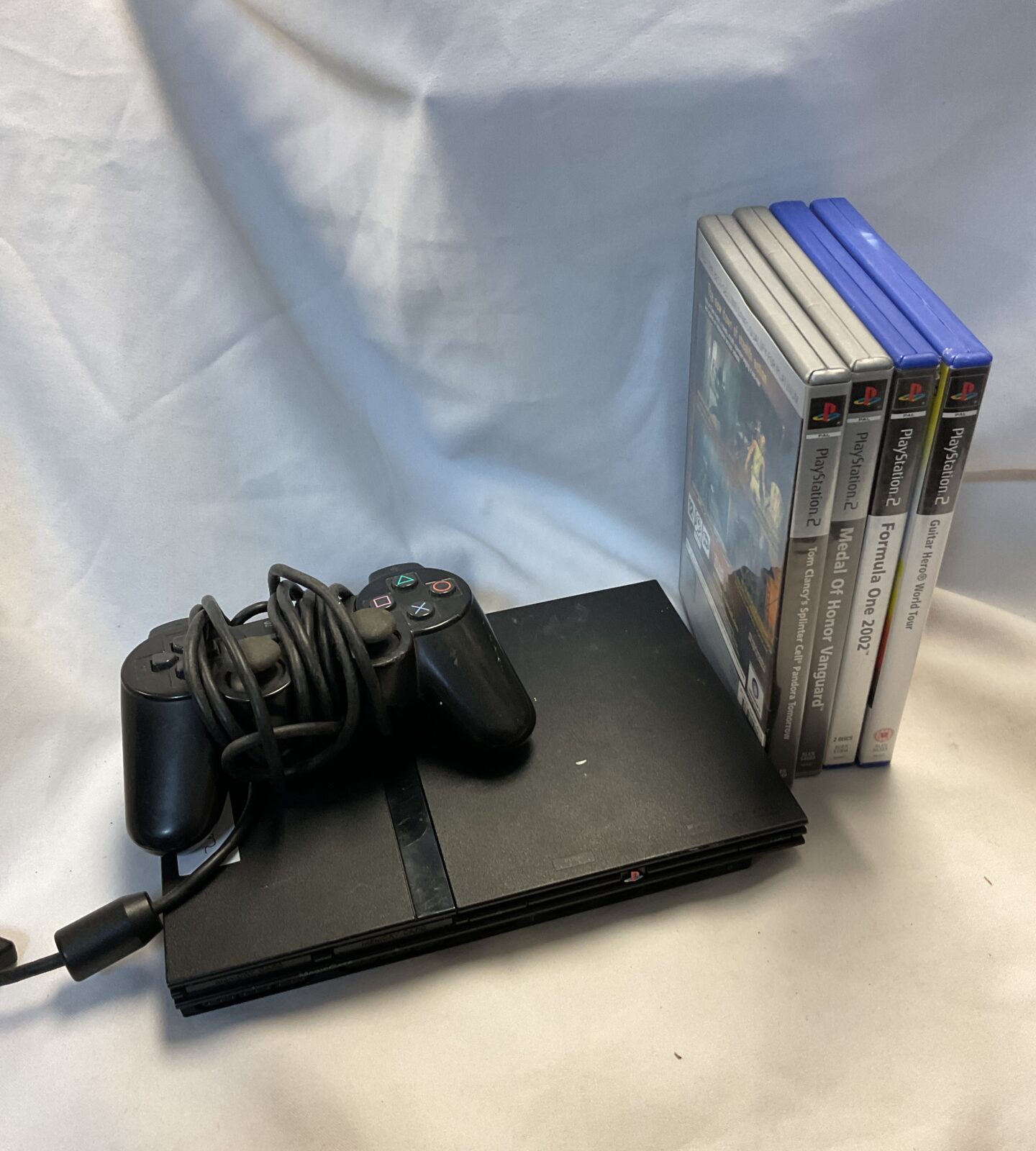 Sony PlayStation 2 slim console with games