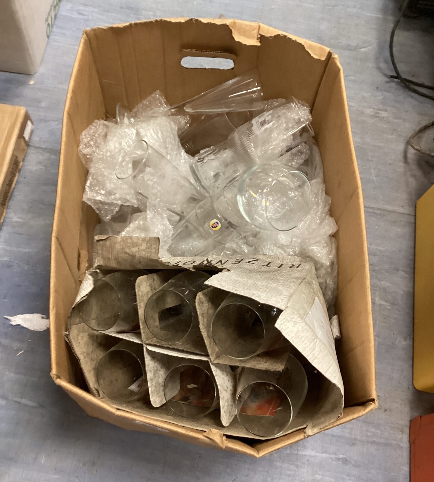 Box of mixed beer glasses inc Fosters