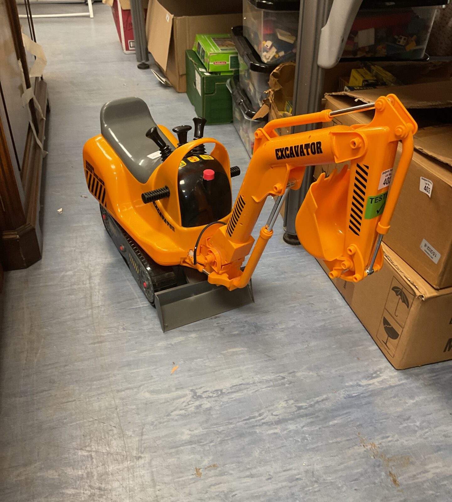Small childrens ride on excavator working