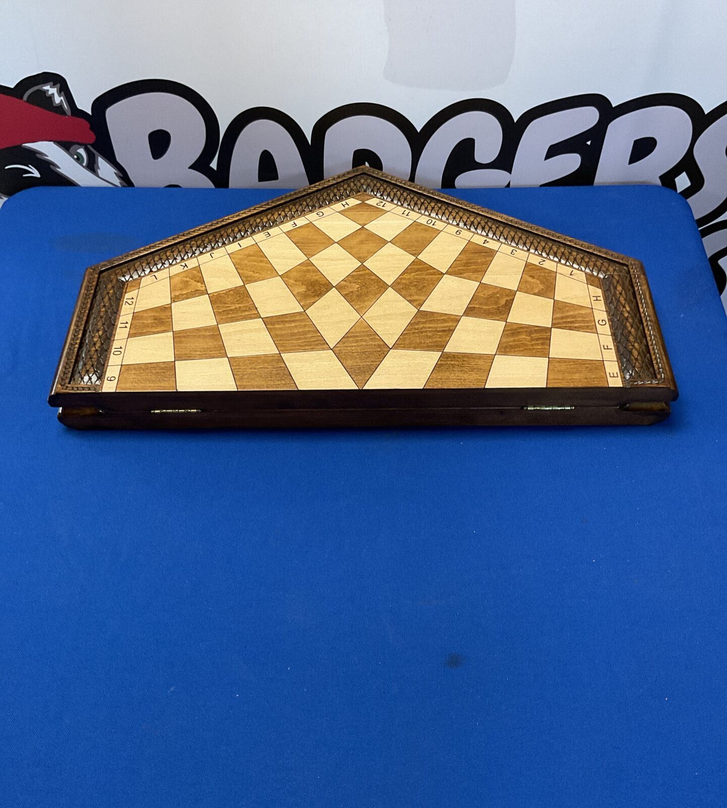 Folding hexagonal three player chess board with pieces