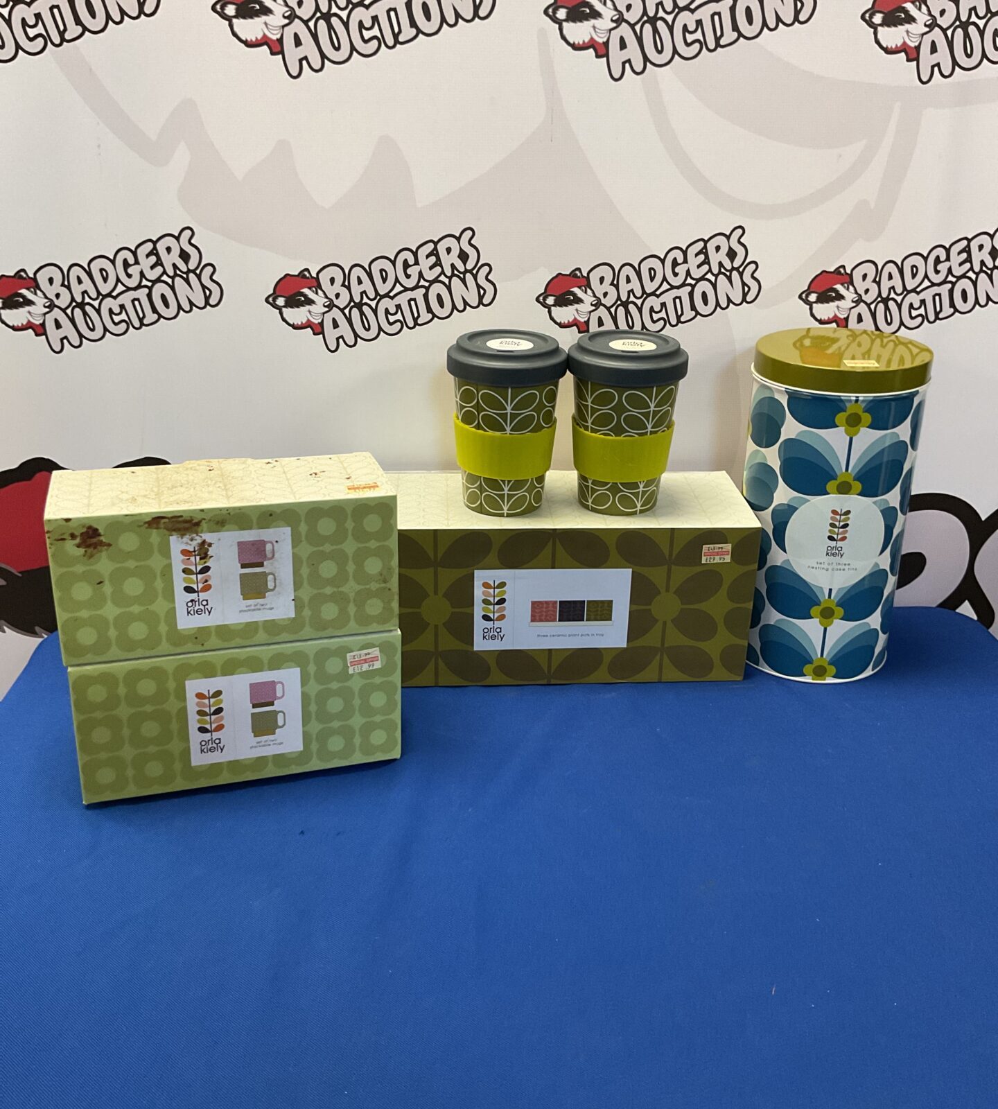 Selection of new orla kiely products inc two sets of two stackable mugs, three ceramic plant pots, two bamboo reusable cups and three nesting cake tins