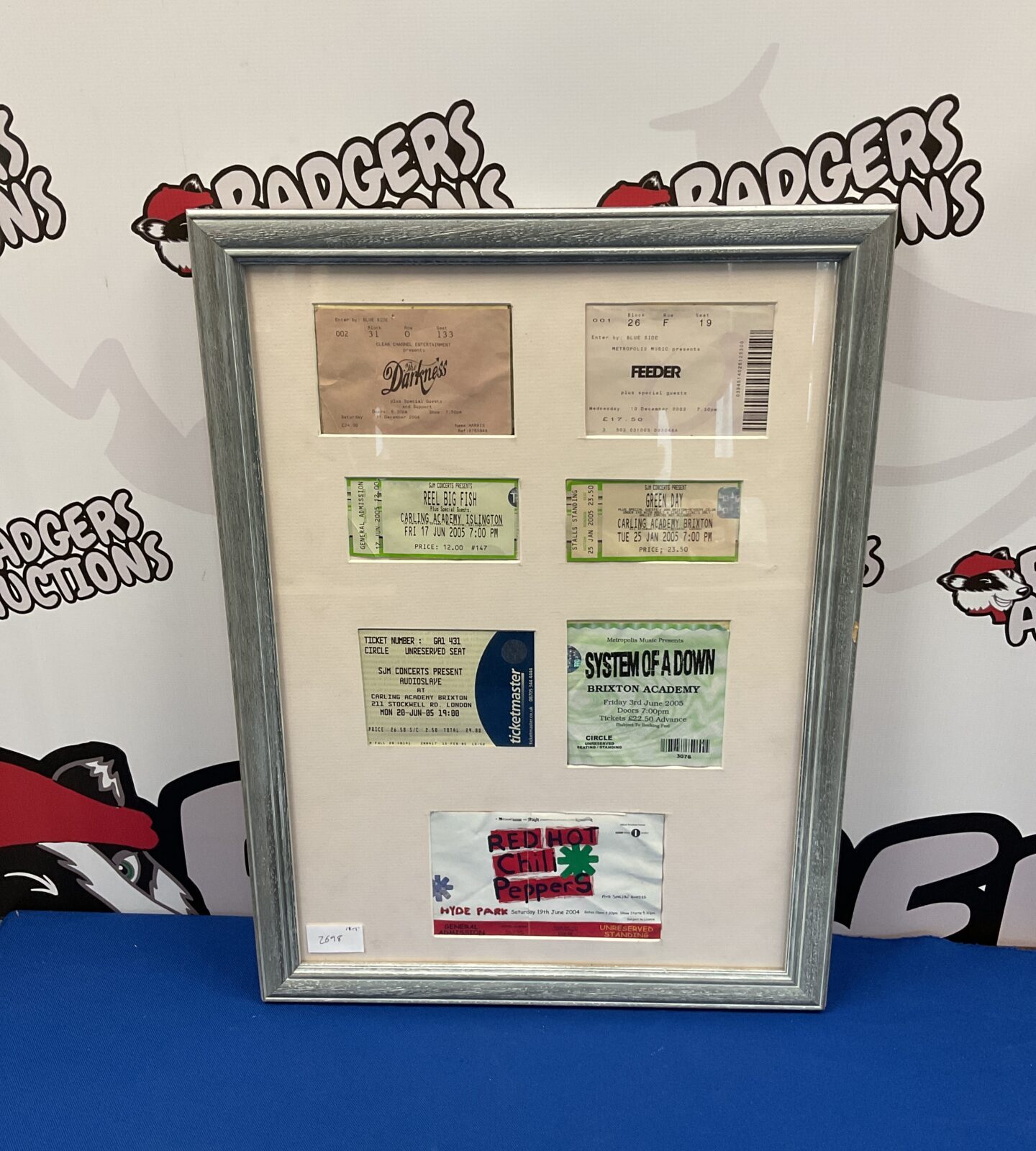 Set of framed rock band concert tickets including system of a down & red hot chilli peppers