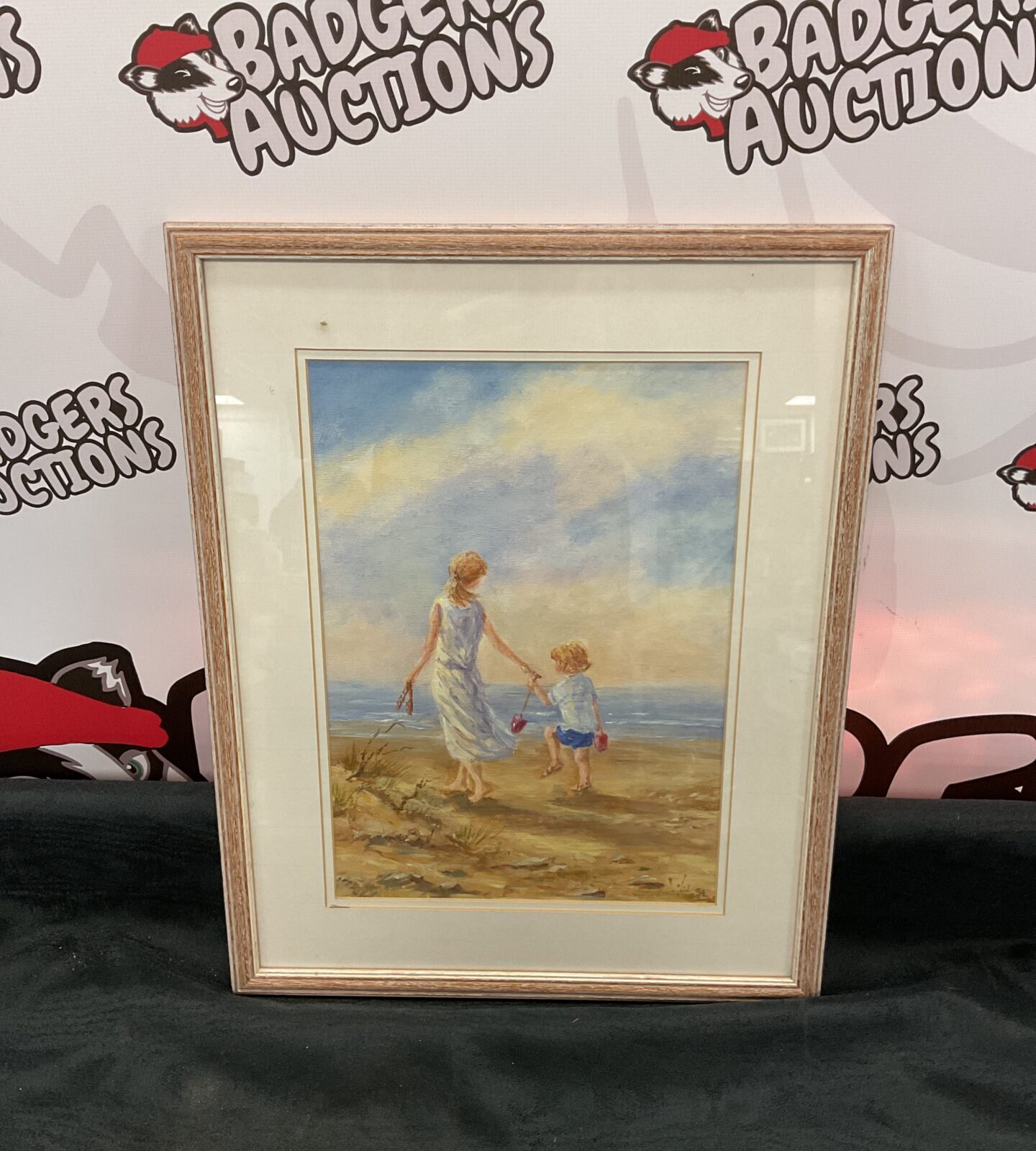Sue looker oil painting of children playing on beach