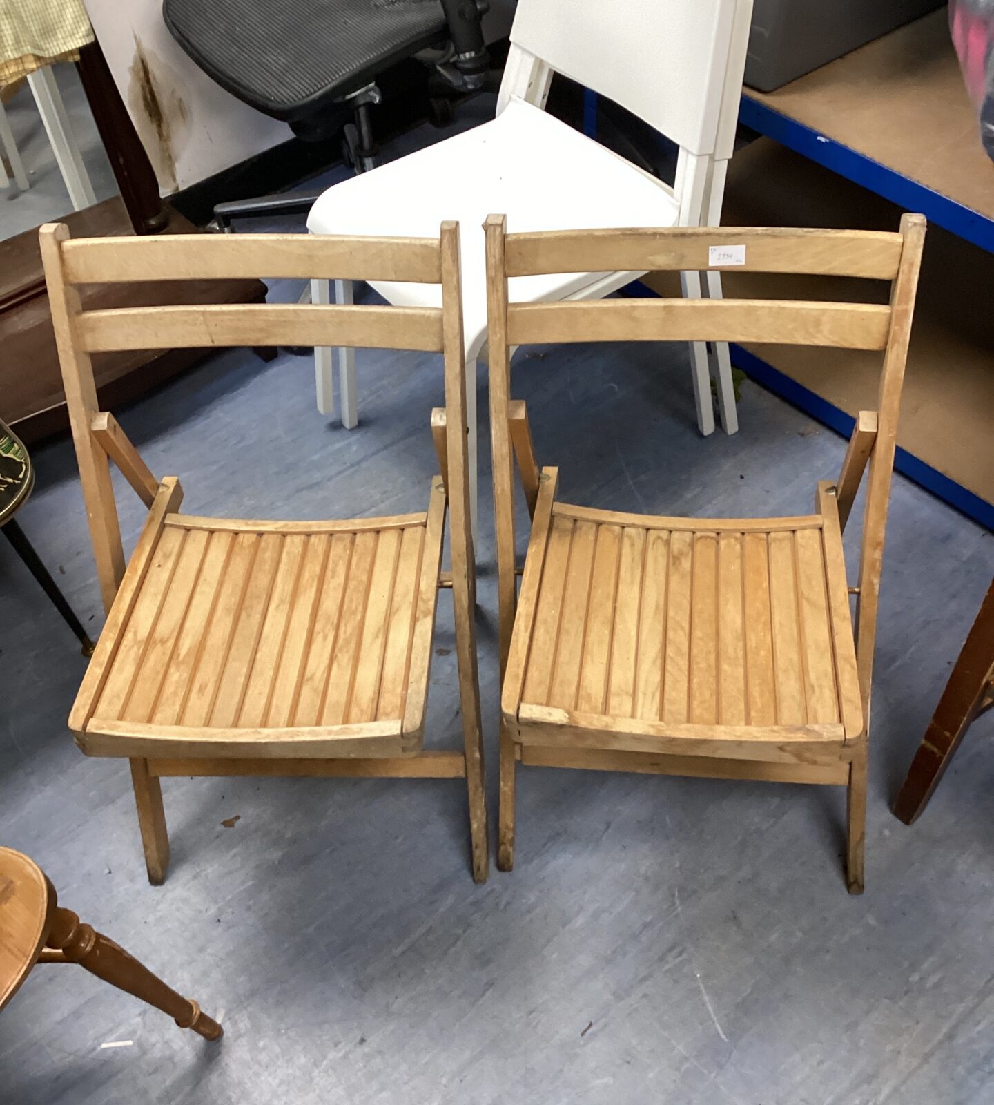 Two vintage folding wooden chairs