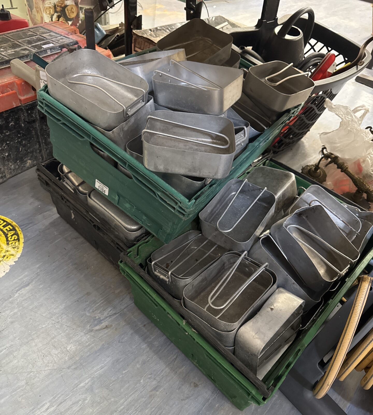 Three trays of mess tins