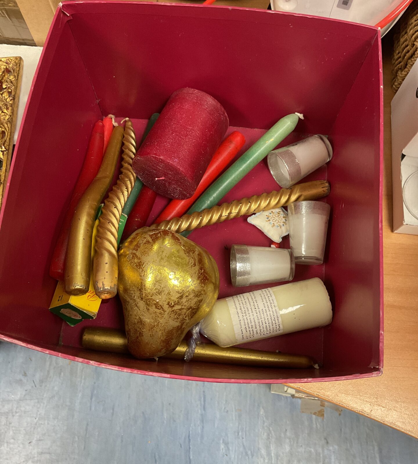 Box of mixed candlesticks and other candles