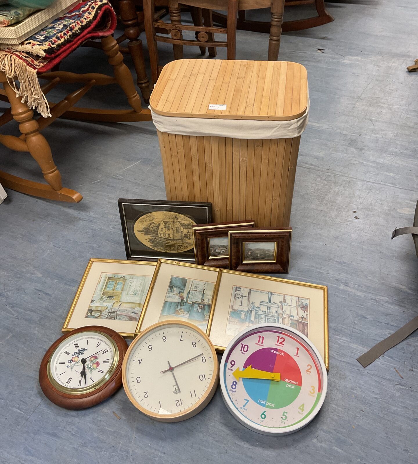 Laundry basket with selection of prints & clocks