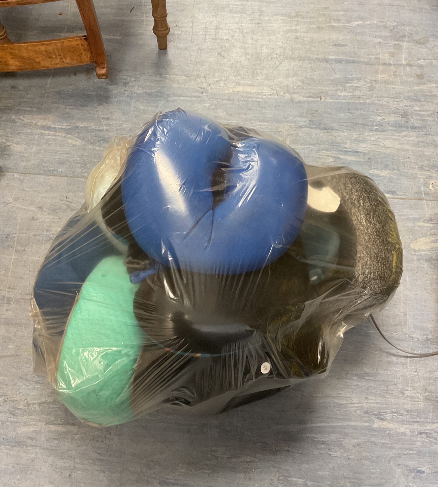 Large sack full of travel cushions