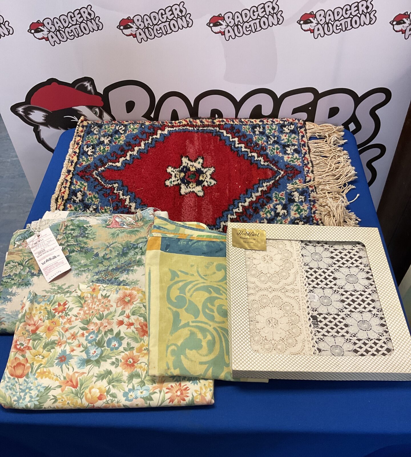 Small wall rug with lace tablecloth & selection of upholstery fabric