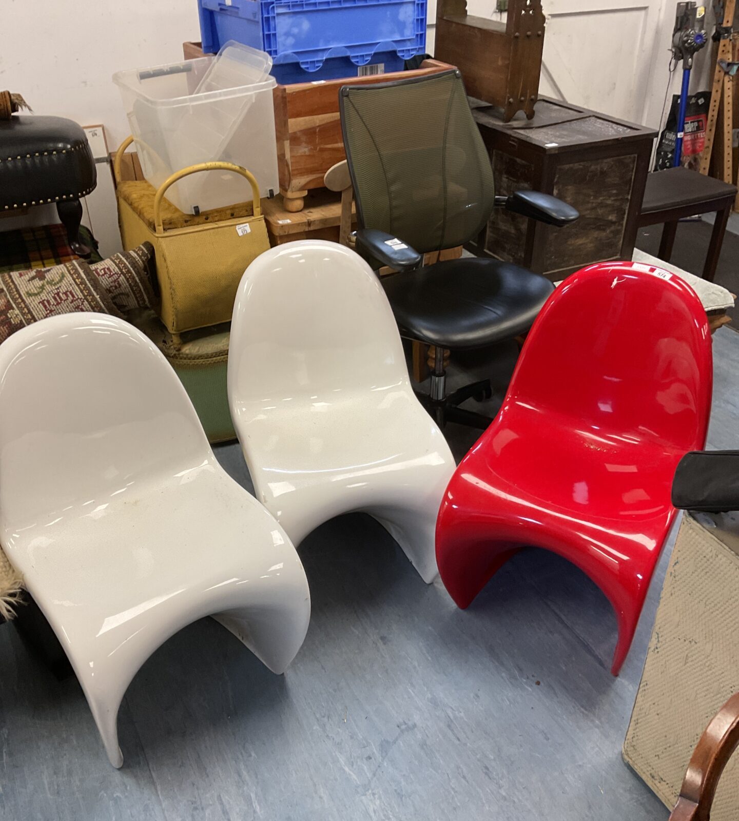 Three designer plastic stacking chairs