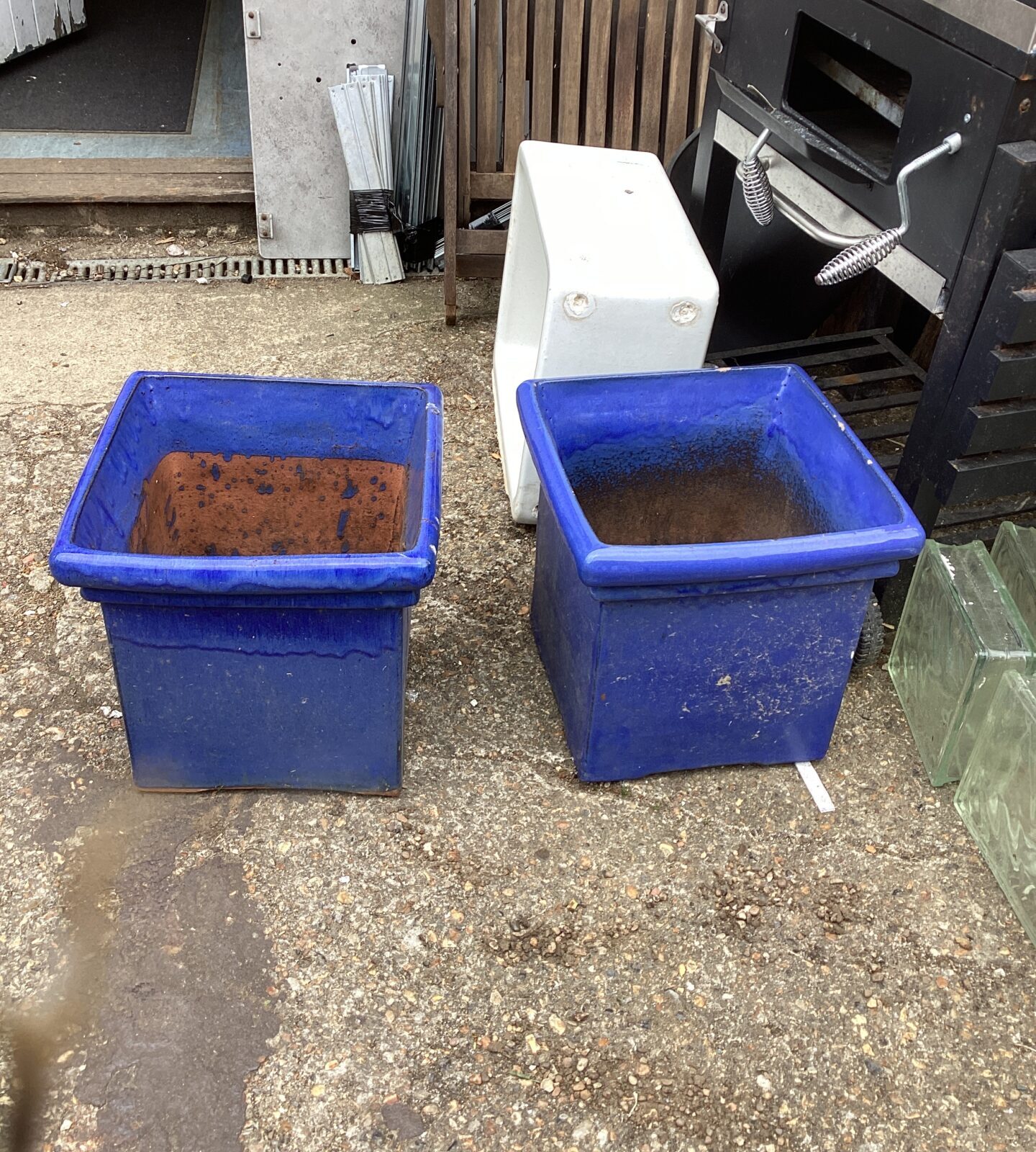 Two large glazed garden tubs one is cracked
