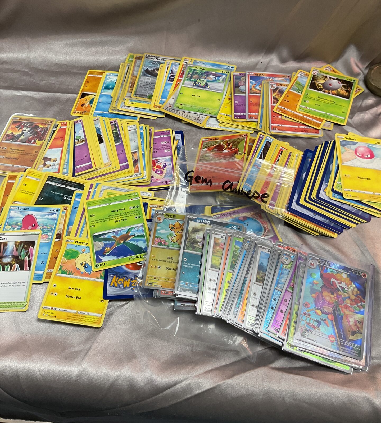 Collection of assorted Pokemon cards inc Gem Chinese