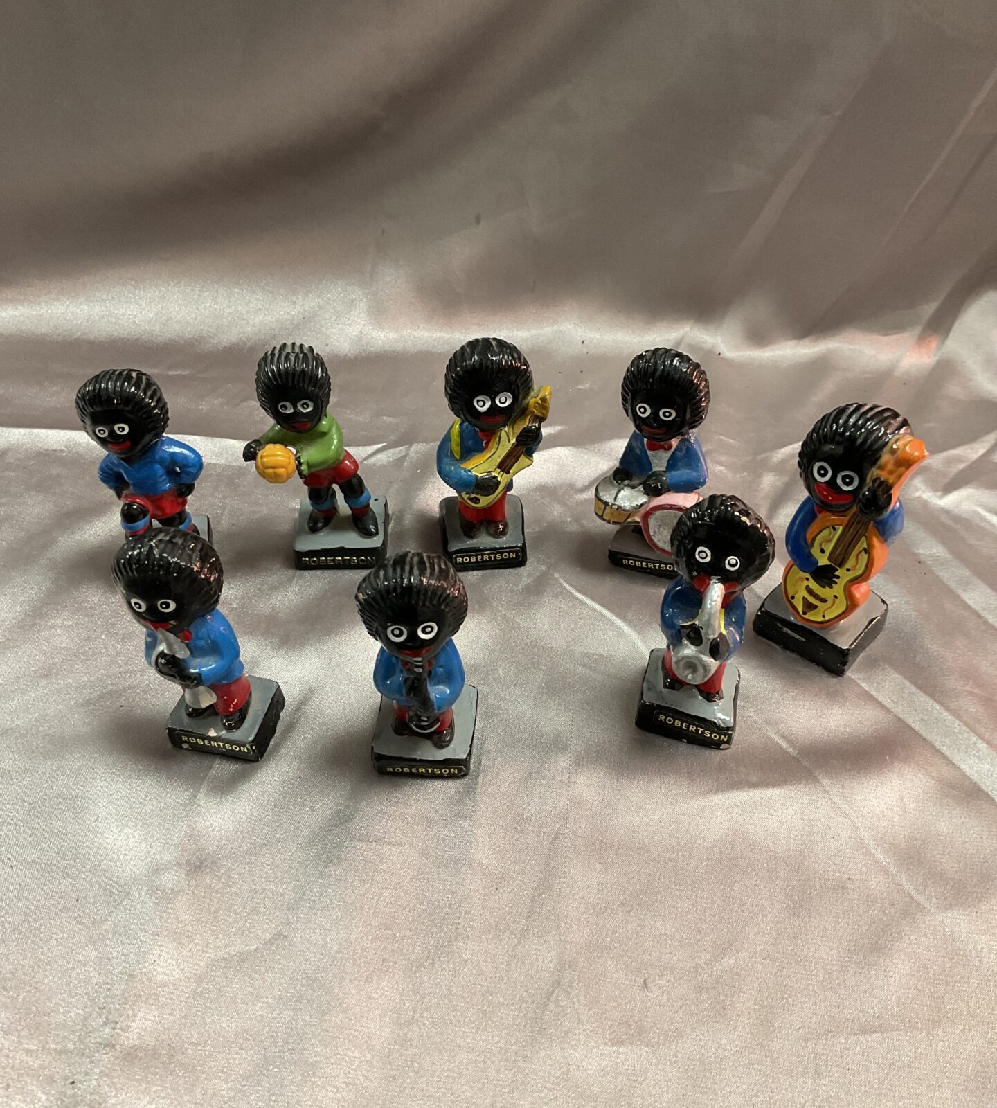 Eight vintage Robertson Golly Figures Musicians and footballers