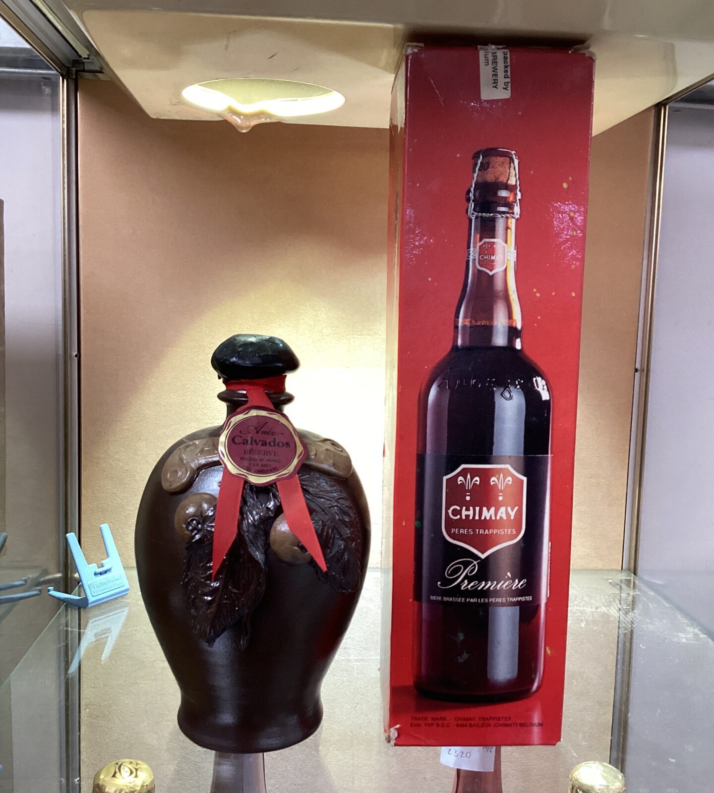 Bottle of Chimay and pottery jug