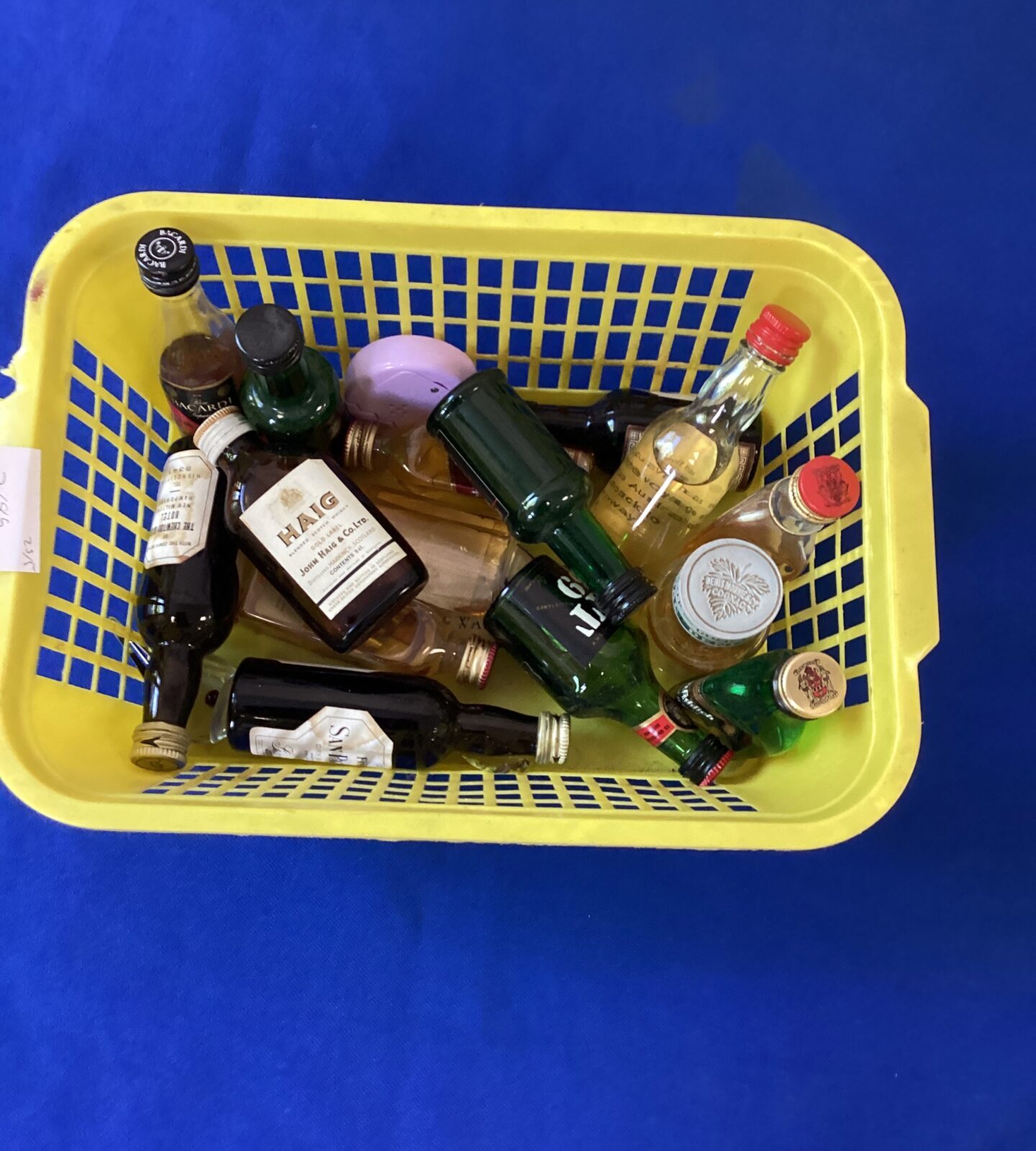 Basket of miniature spirit bottles