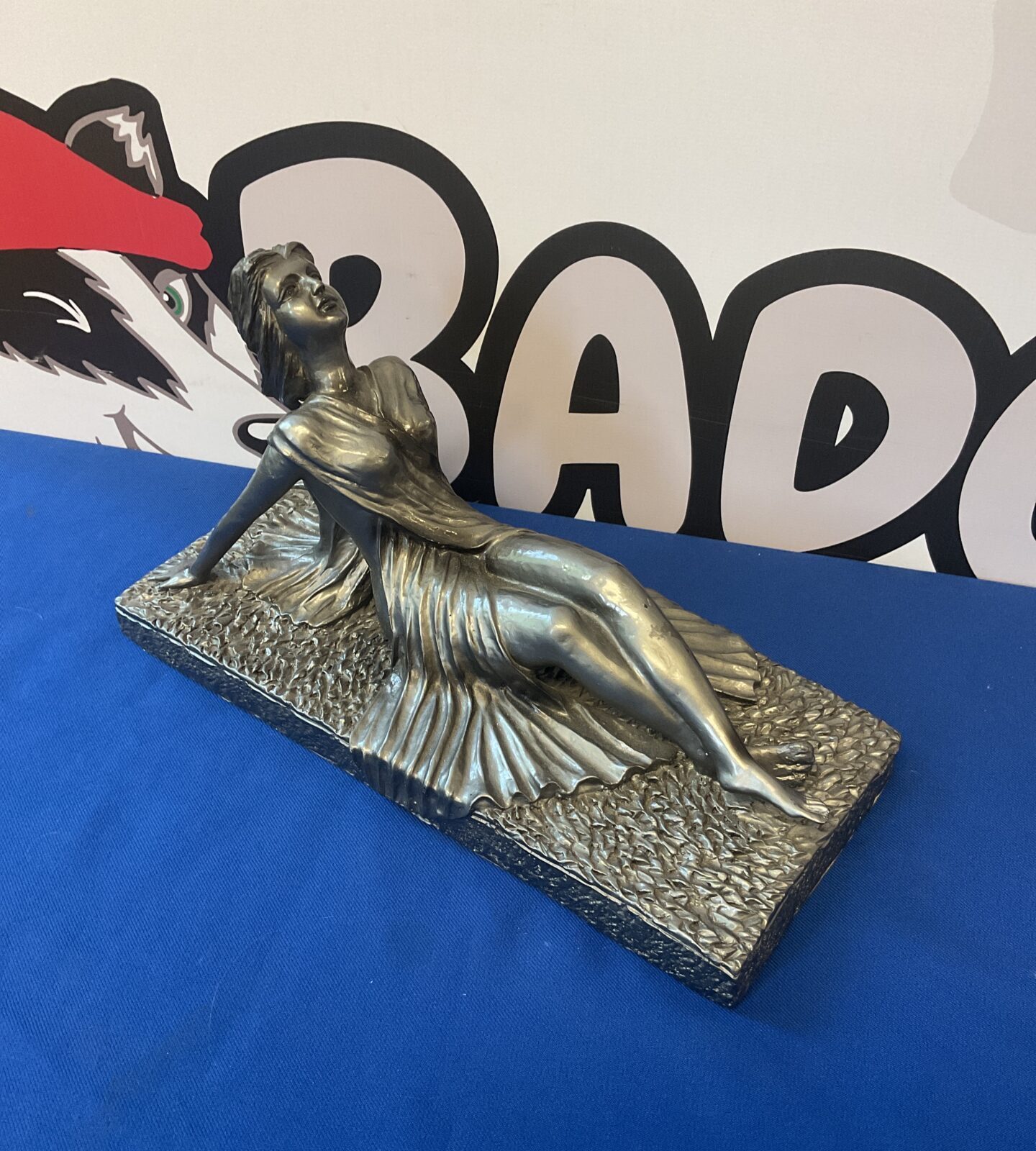 Silvered resin sculpture of a reclining art deco lady