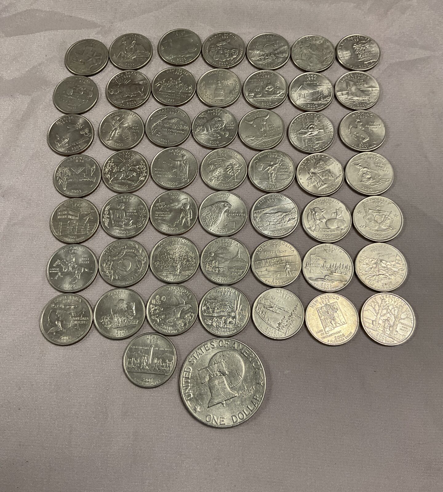 the 50 states of america quarter coins and a liberty dollar