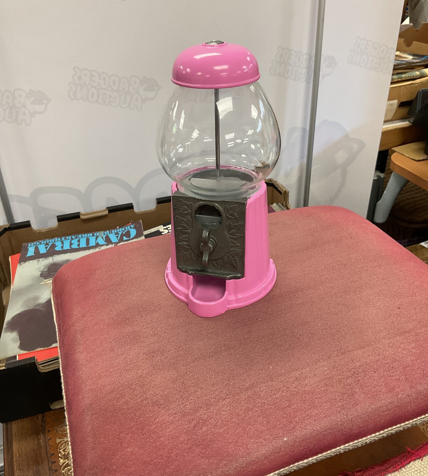 Glass domed metal gumball machine
